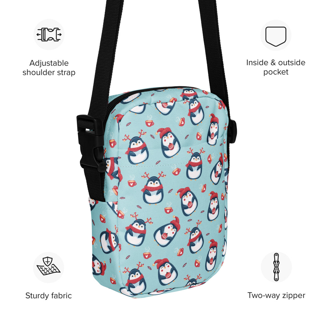 Light blue girls reindeer penguin crossbody purse with playful cartoon penguin pattern and black adjustable straps