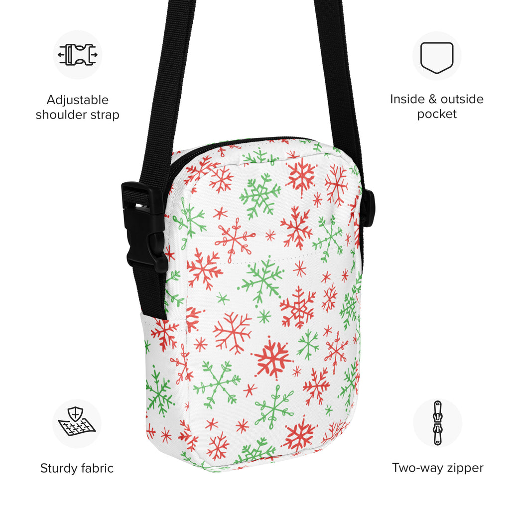 Girls white crossbody purse with red and green snowflake pattern and black adjustable strap for festive use