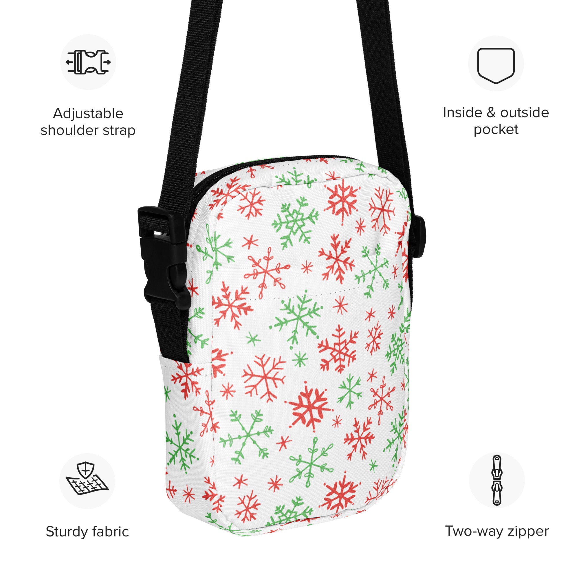 Girls white crossbody purse with red and green snowflake pattern and black adjustable strap for festive use