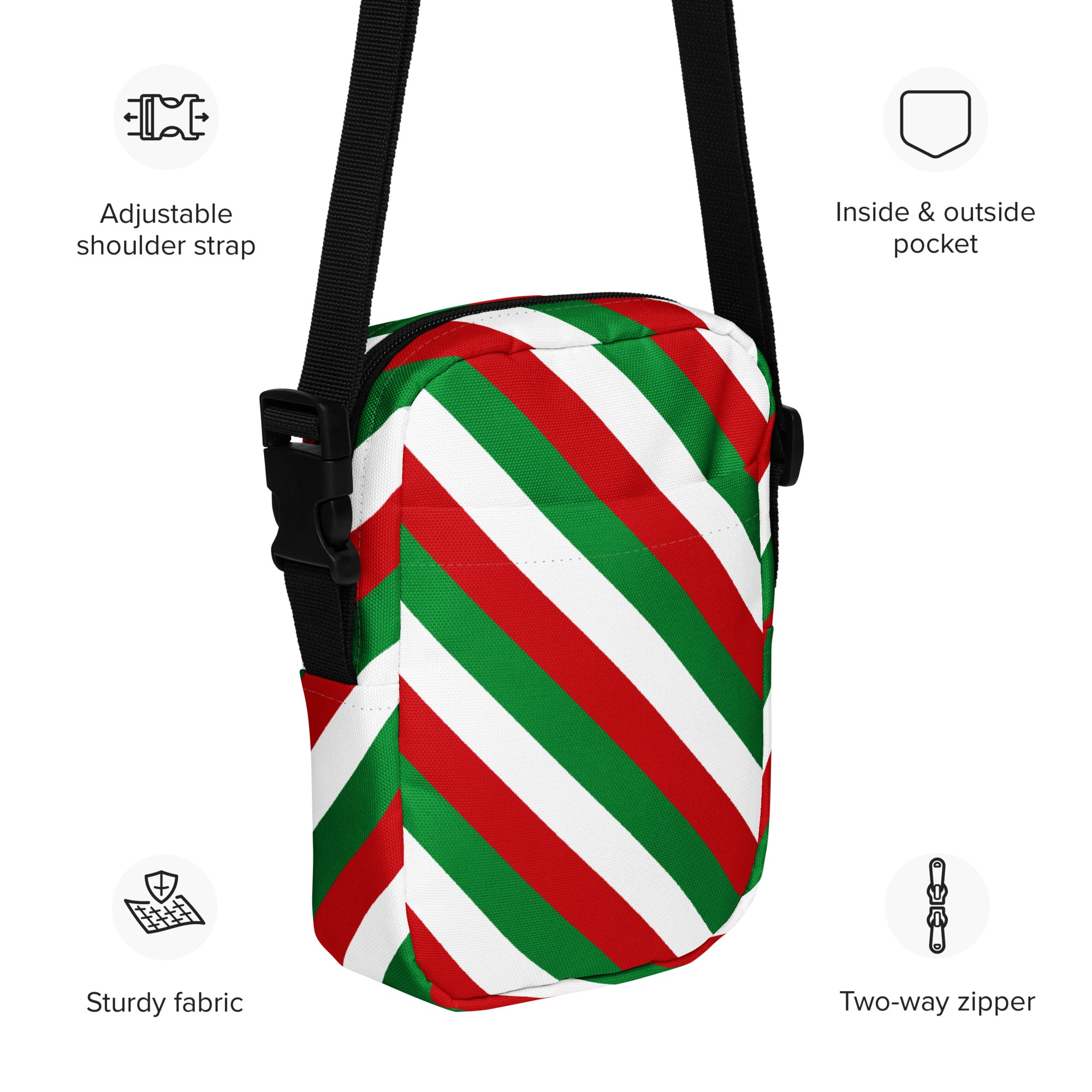 A festive red green and white diagonally striped crossbody purse with a black adjustable strap for women