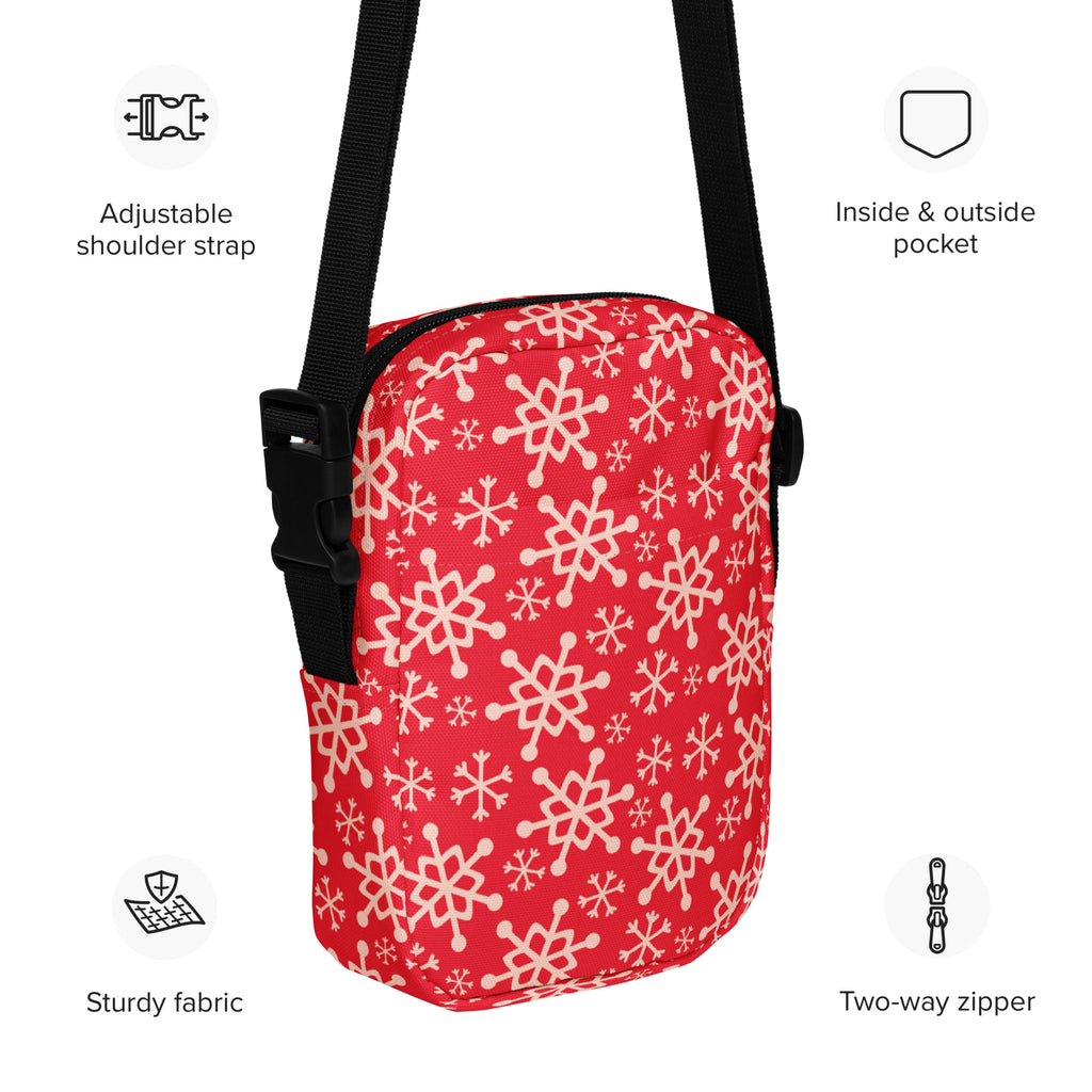 Red snowflake christmas women’s crossbody purse in red with white snowflake pattern and black adjustable strap