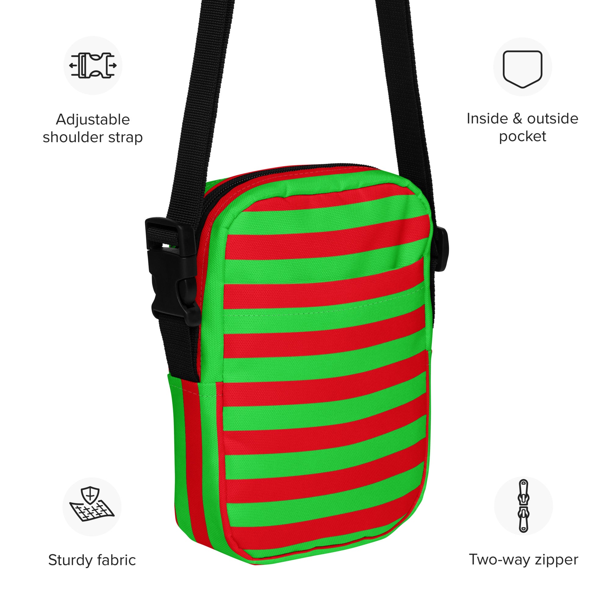 A vibrant red and green striped Christmas women’s crossbody purse with a black adjustable strap