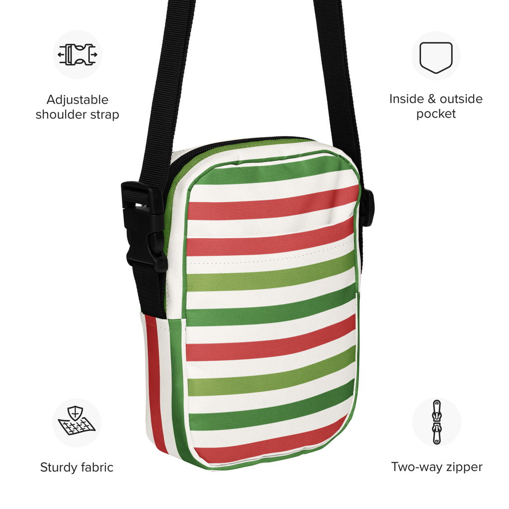 A compact christmas striped women’s crossbody purse with bold red green and white horizontal stripes on sturdy fabric