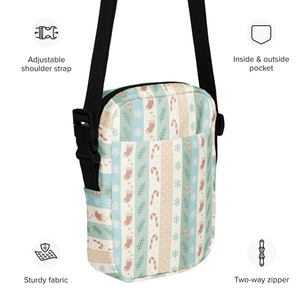 Girls pastel striped christmas crossbody purse with a soft fabric festive pattern of candy canes stockings and snowflakes