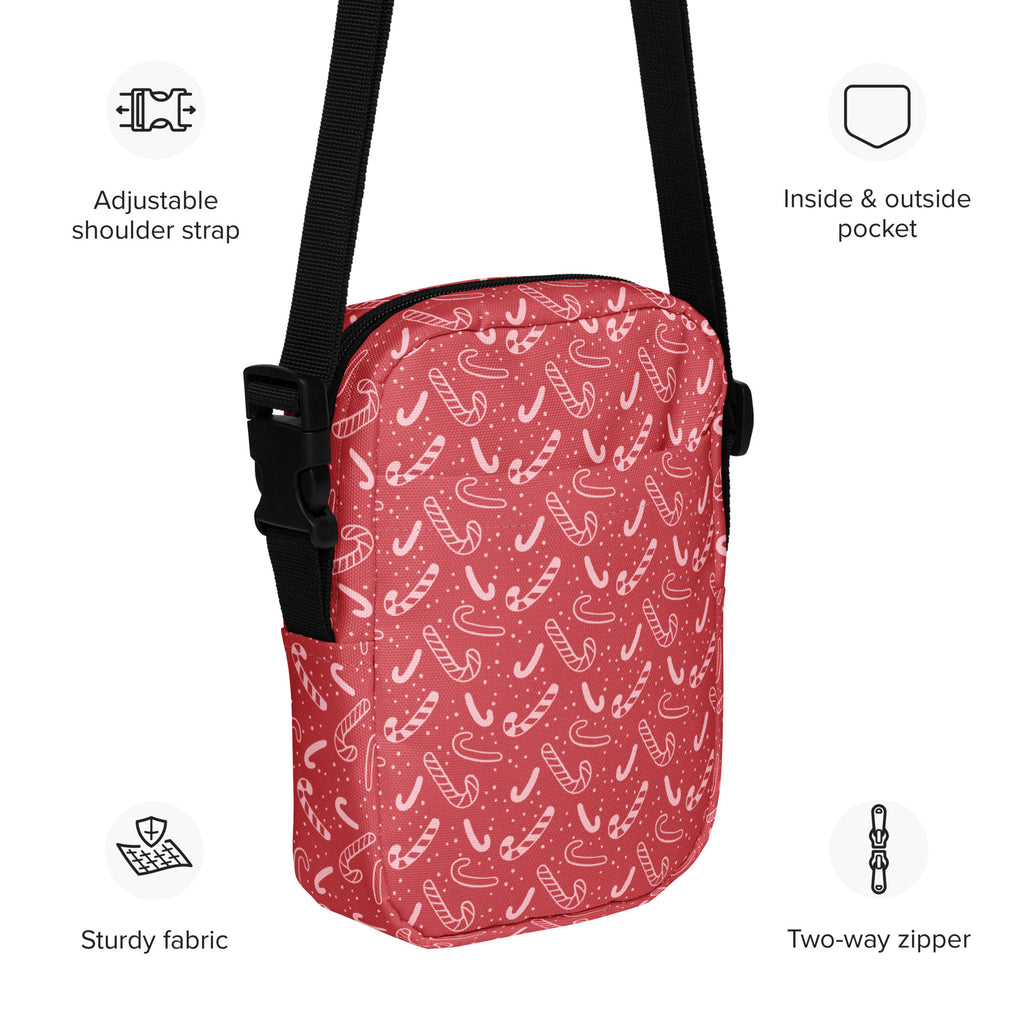 Girls red candy cane patterned crossbody purse with black adjustable strap and two-way zipper for Christmas use