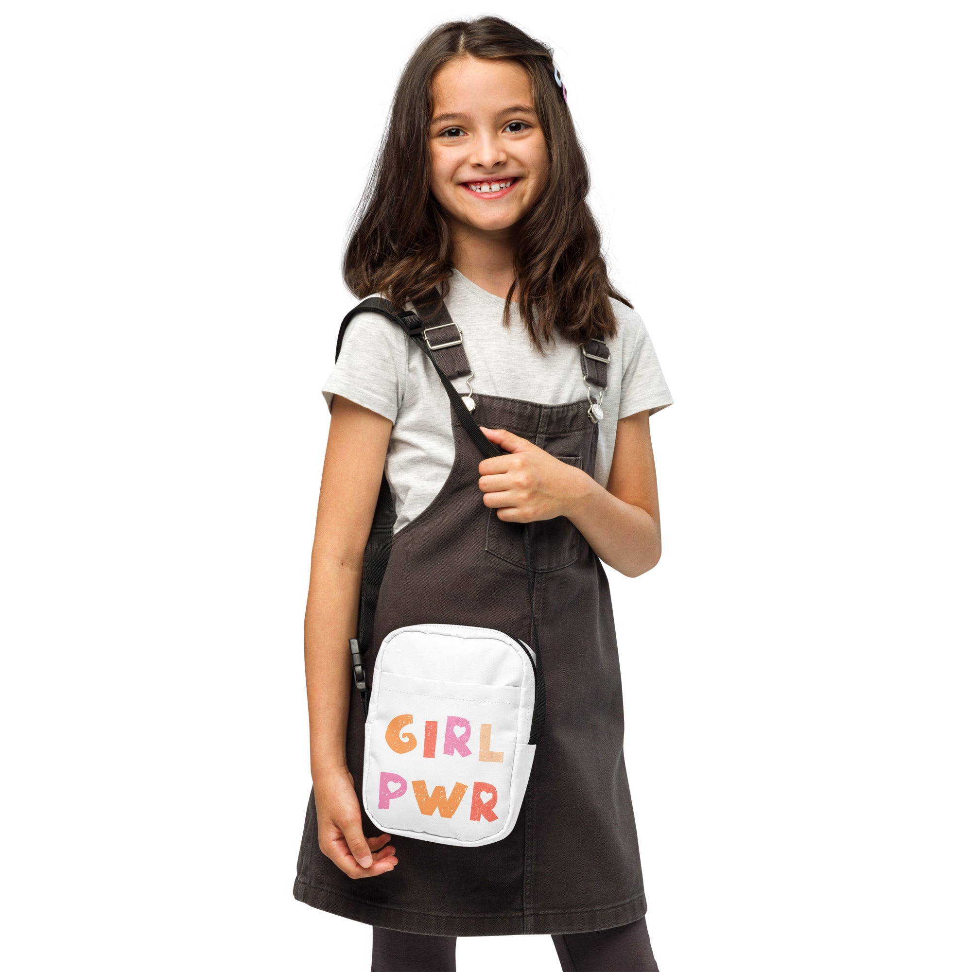 White crossbody bag with colorful girl pwr print designed as a kids purse for everyday use