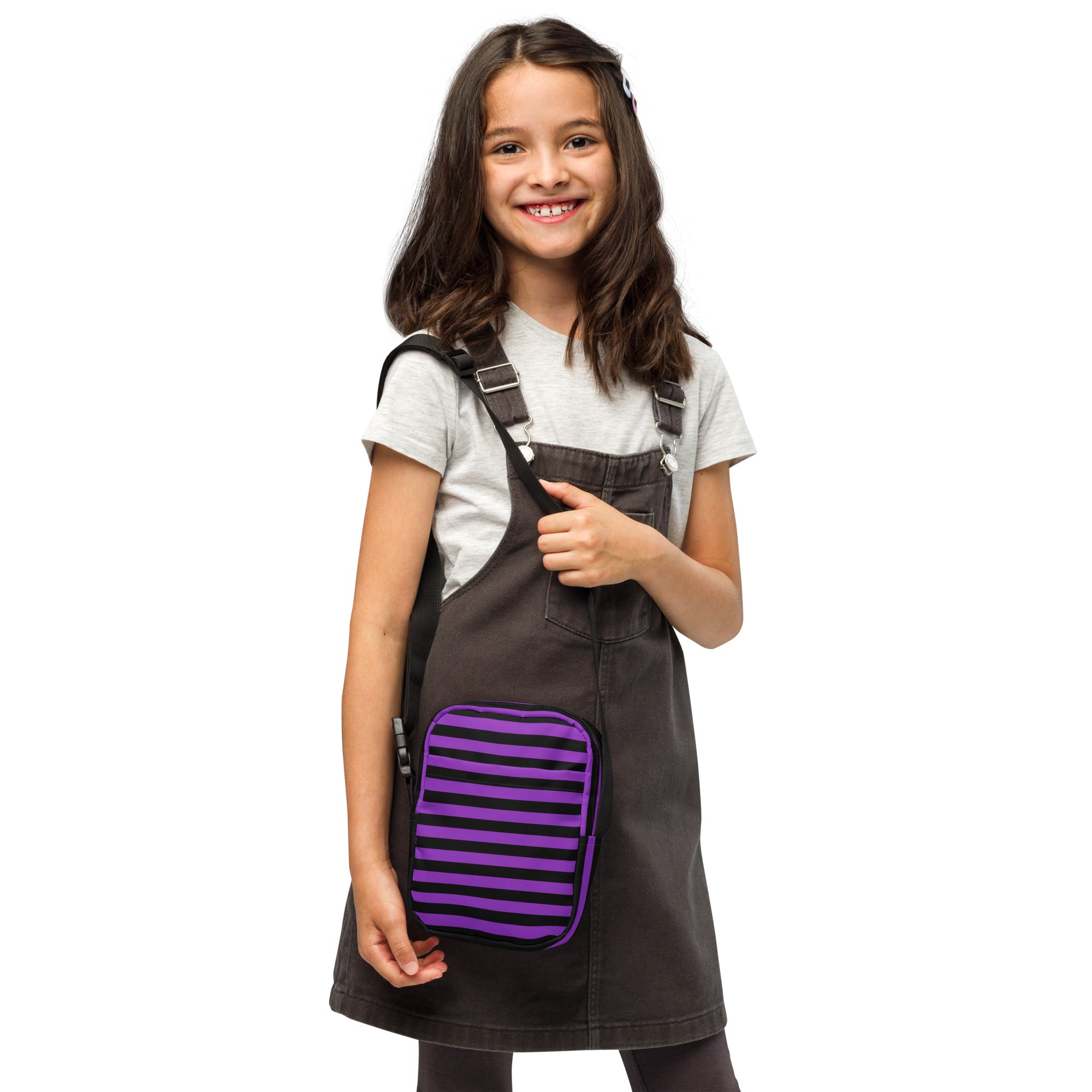 Dark gray denim overalls with a purple and black striped front pocket perfect for girls purple and black striped halloween crossbody purse use