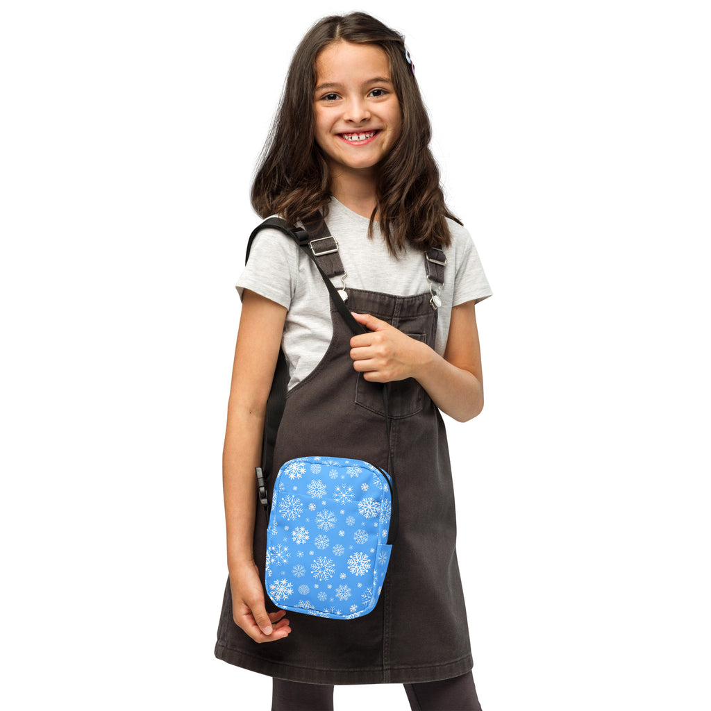 Girls blue snowflake crossbody purse rectangular pouch with black straps and winter pattern perfect for casual use