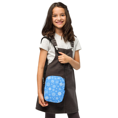 Girls blue snowflake crossbody purse rectangular pouch with black straps and winter pattern perfect for casual use