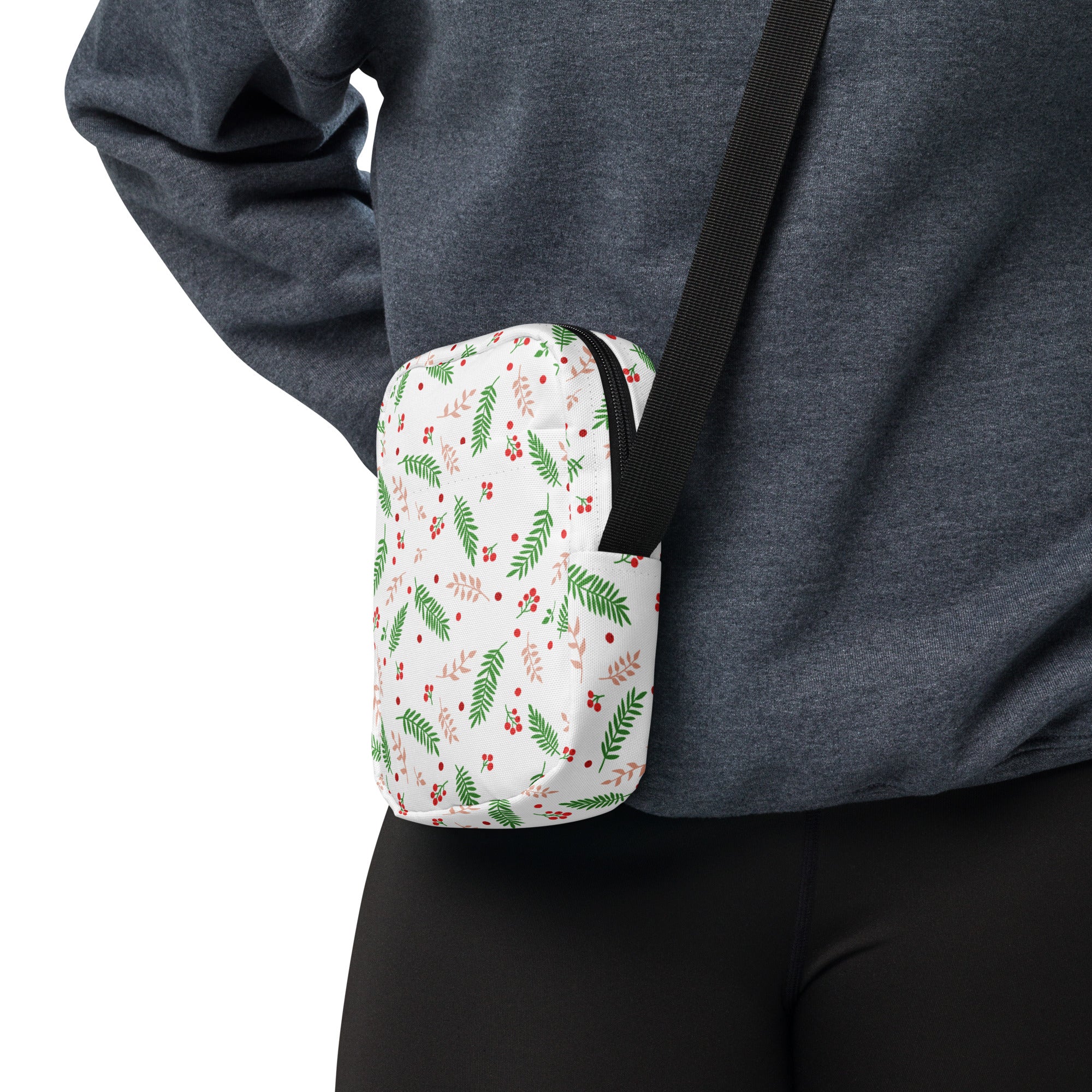 White winter fern and berry crossbody purse with green leaves red berries pattern and black adjustable strap