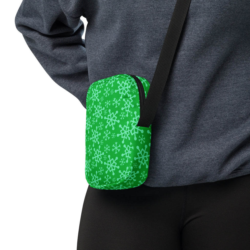 Green snowflake christmas women’s crossbody purse with light green snowflake pattern and black adjustable strap