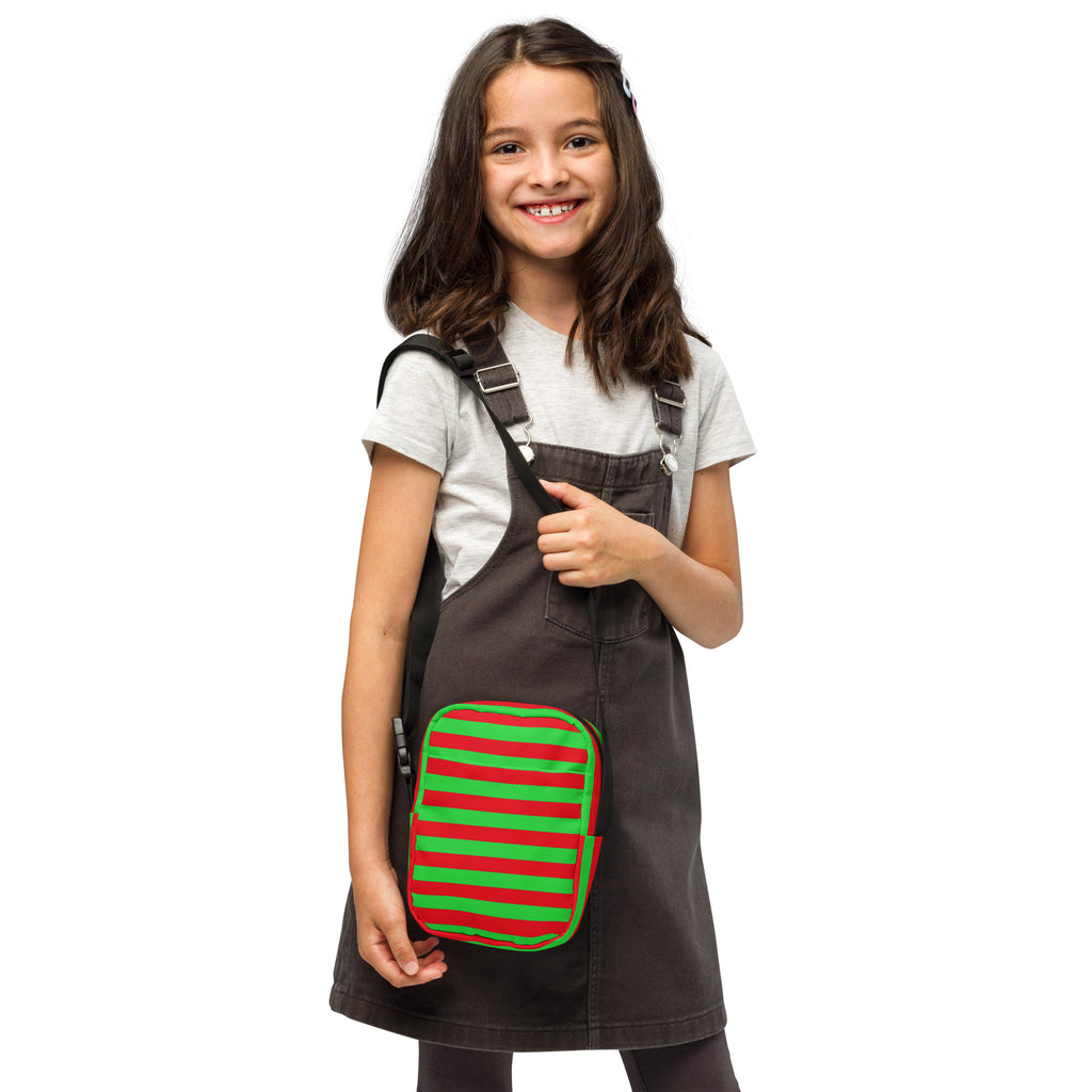 A vibrant red and green striped lunch bag with a playful festive design for girls holiday use