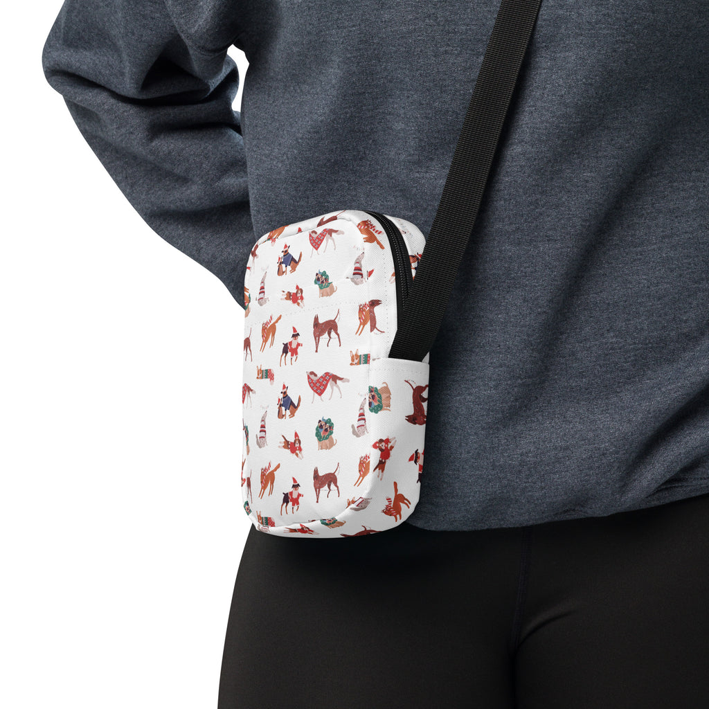 White crossbody purse with festive holiday dogs pattern and red brown accents perfect for Christmas use
