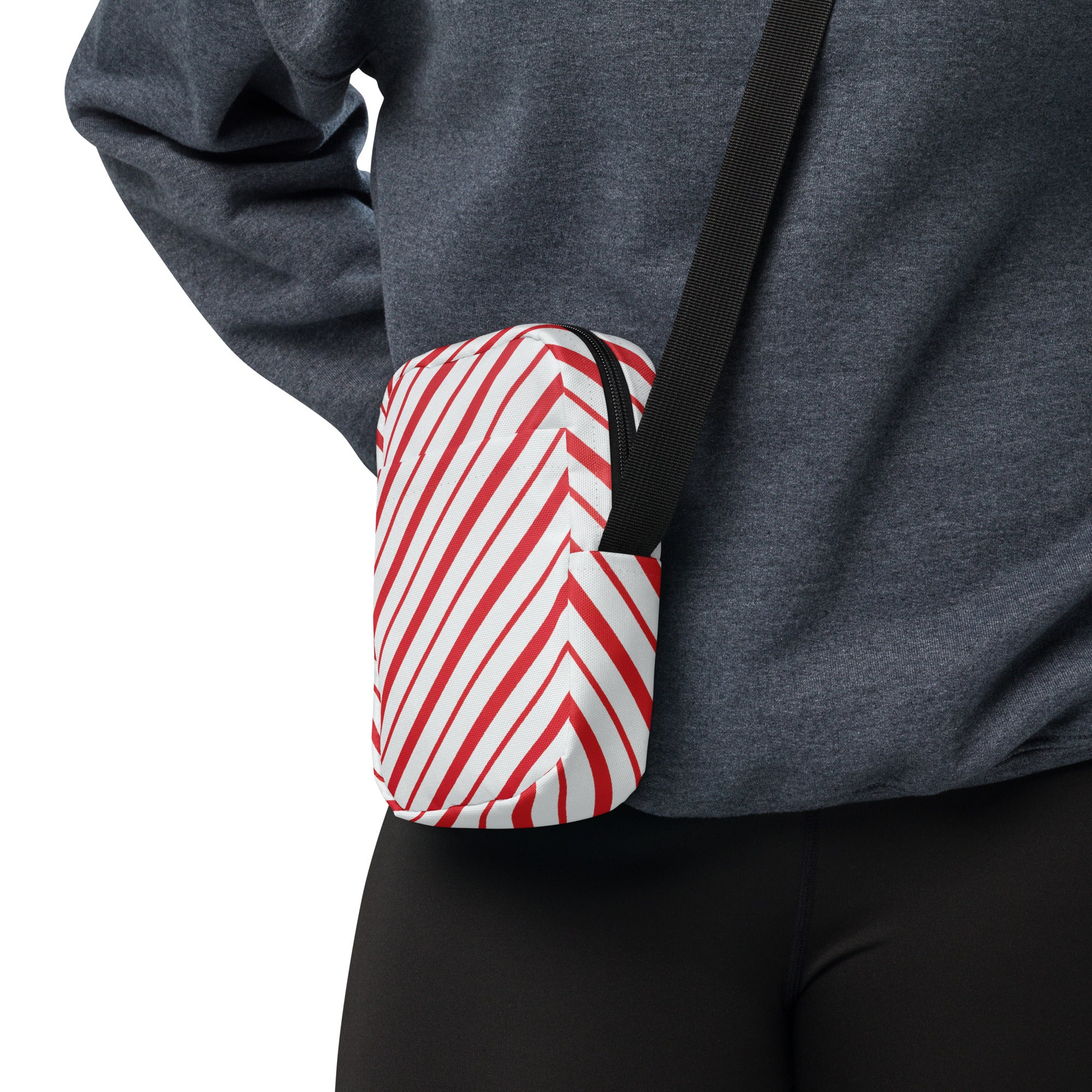 Red candy stripe Christmas women’s crossbody purse with compact red and white chevron pattern and black strap