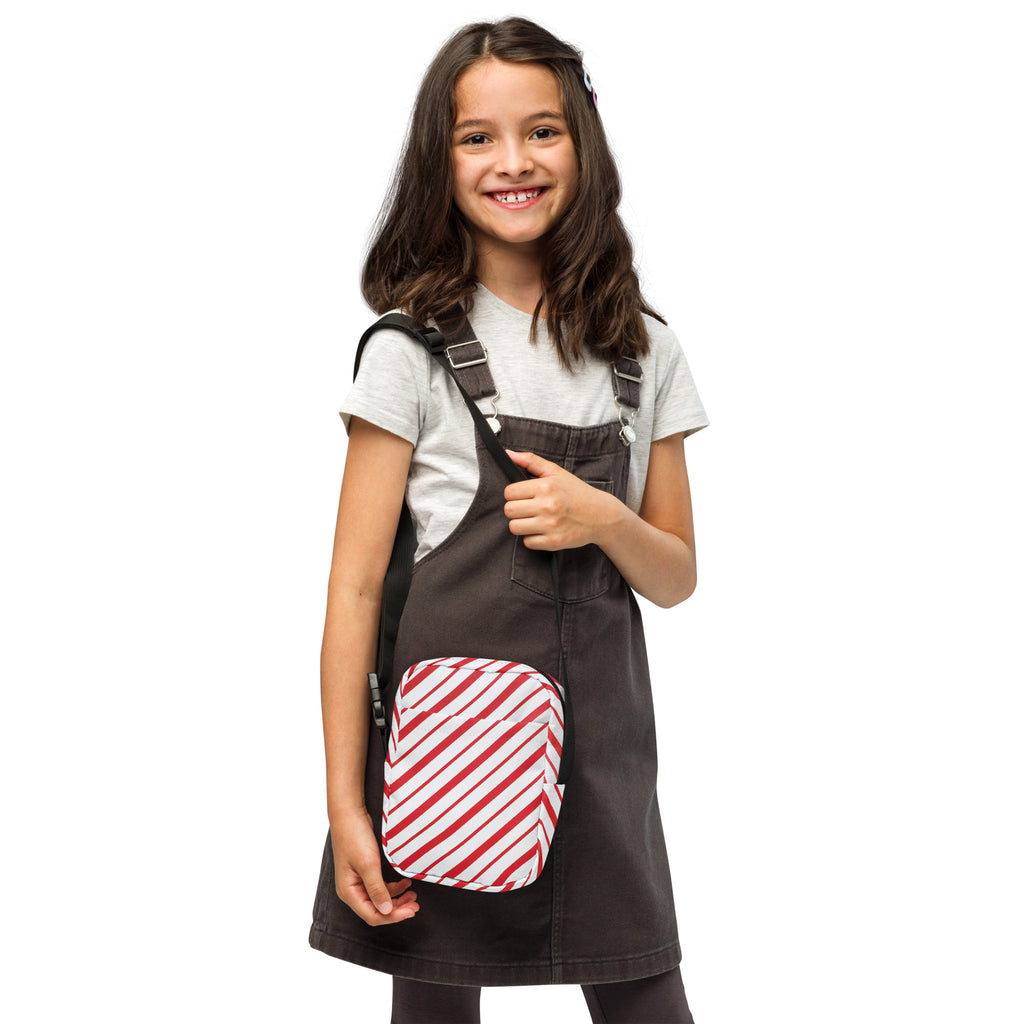 Dark gray denim overalls with a red and white striped patch pocket for girls candy cane stripe christmas crossbody purse