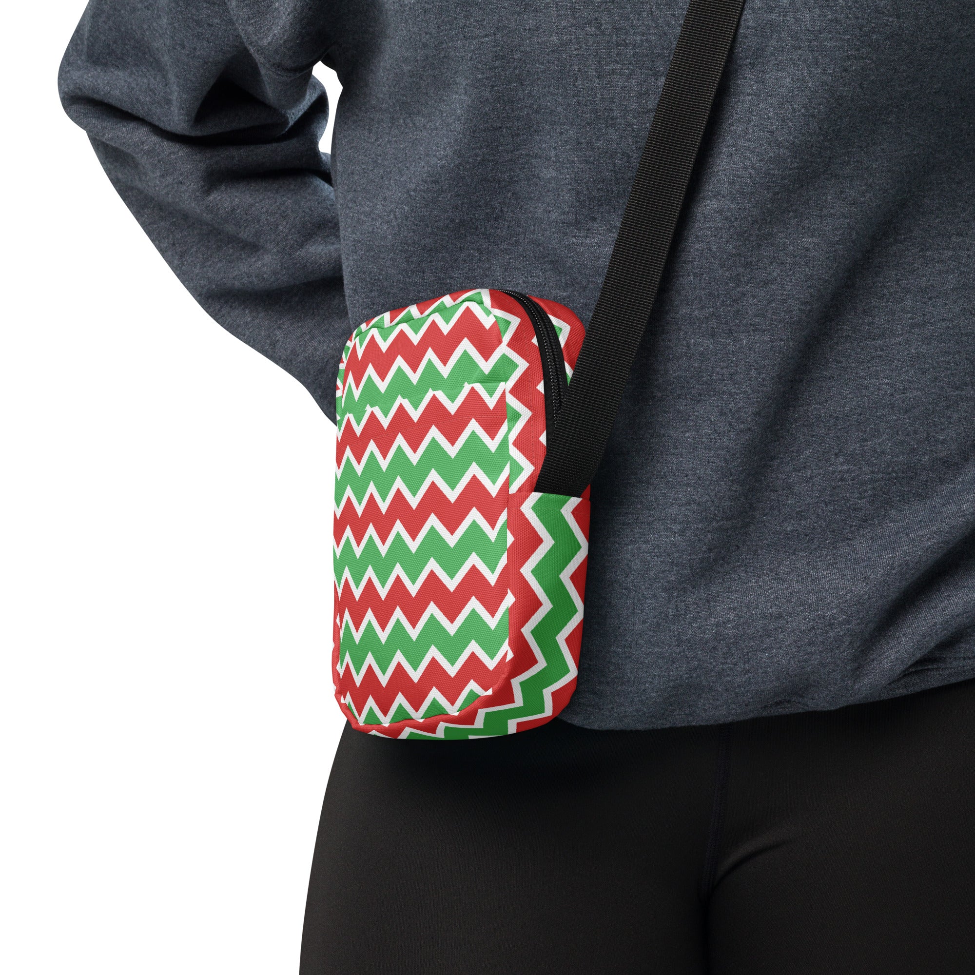 A compact crossbody purse with vibrant red green and white zigzag pattern perfect for Christmas use