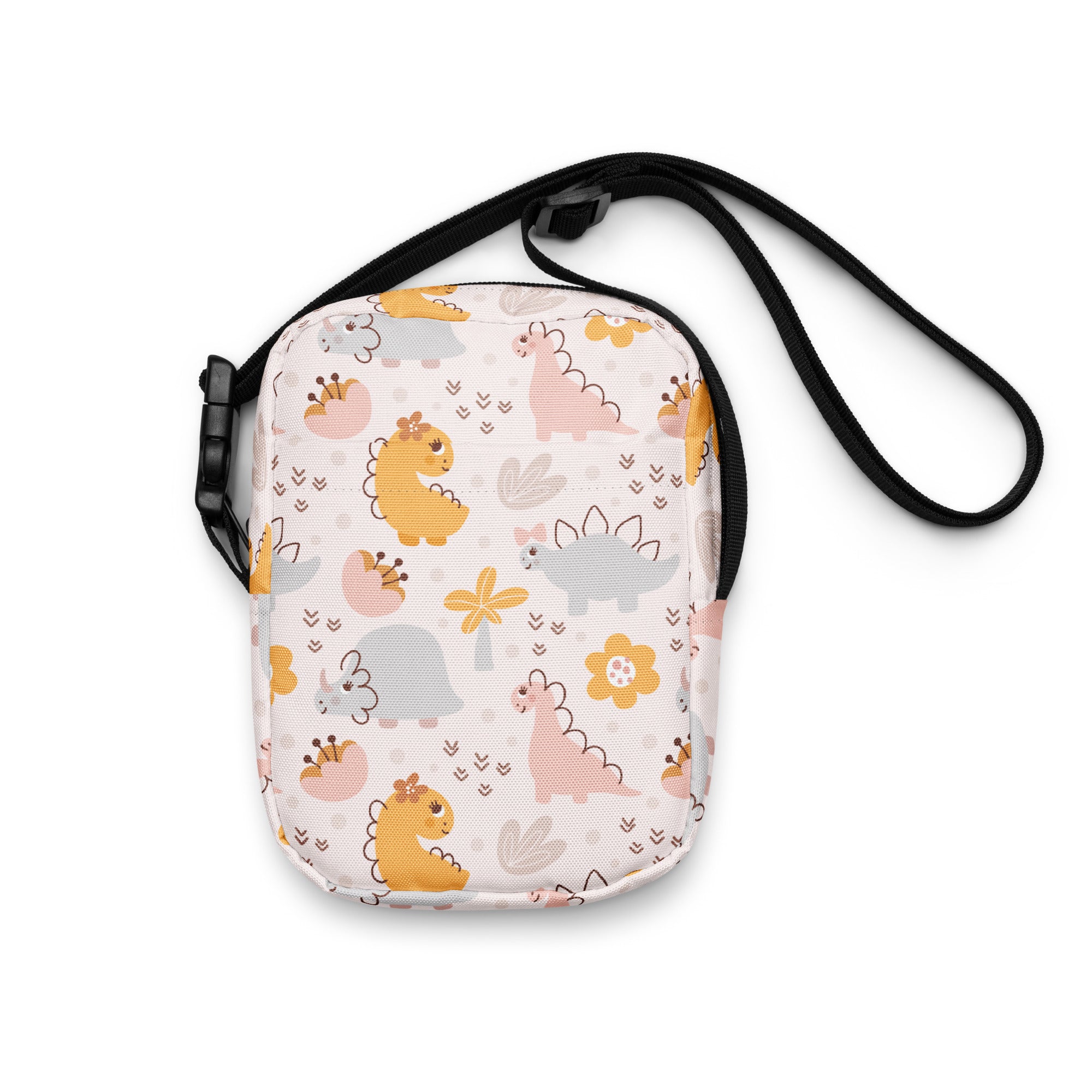 A charming white girls floral dinosaur crossbody purse with yellow pink and gray cartoon dinosaurs and flowers
