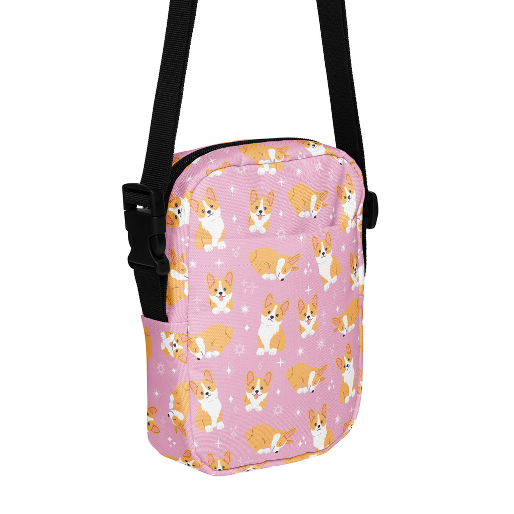 Girls pink corgi crossbody purse with playful orange and white cartoon corgis and star motifs on light pink background