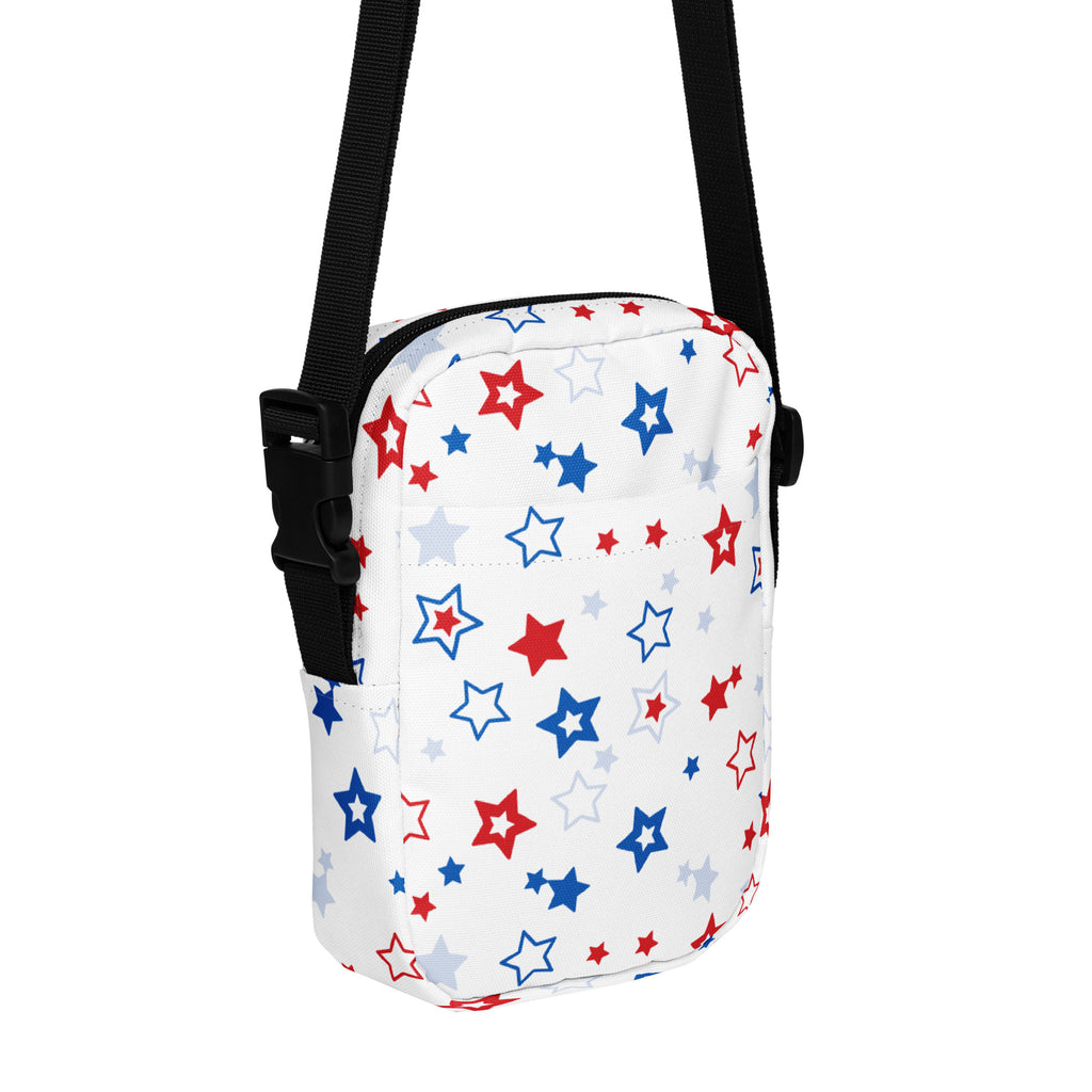 White crossbody bag with red blue and silver star pattern on fabric surface for girls