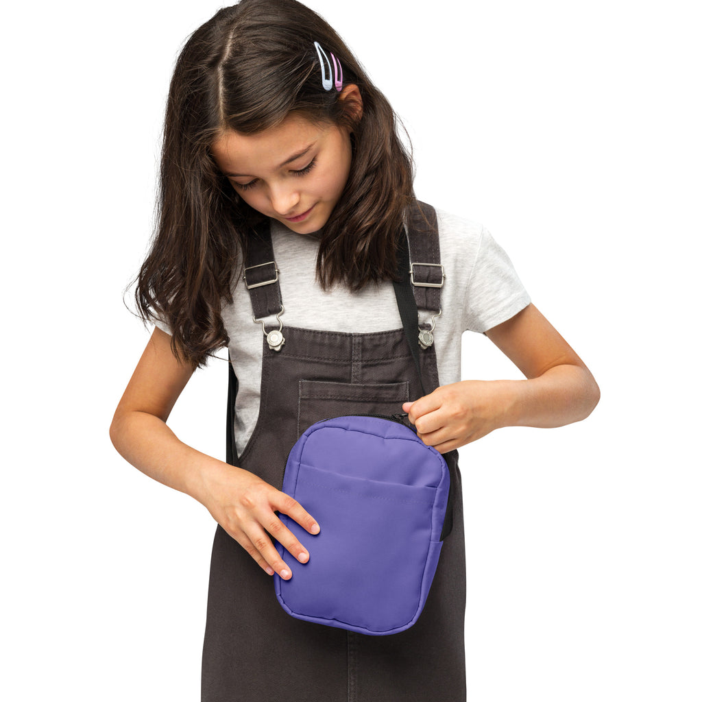 Girls purple crossbody purse made of durable fabric with a purple rectangular pouch and zipper closure