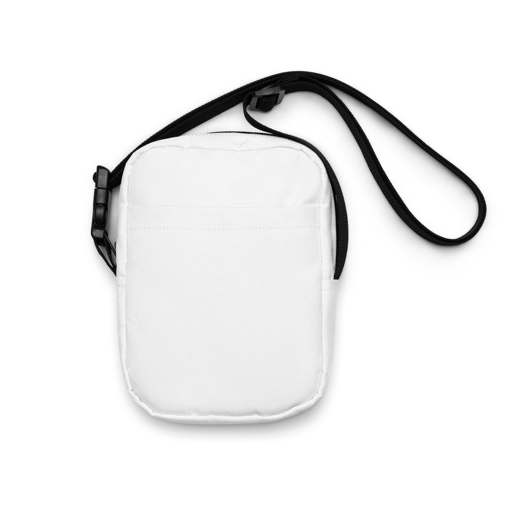 Girls white crossbody purse featuring a white canvas body with a black adjustable strap and plastic buckle