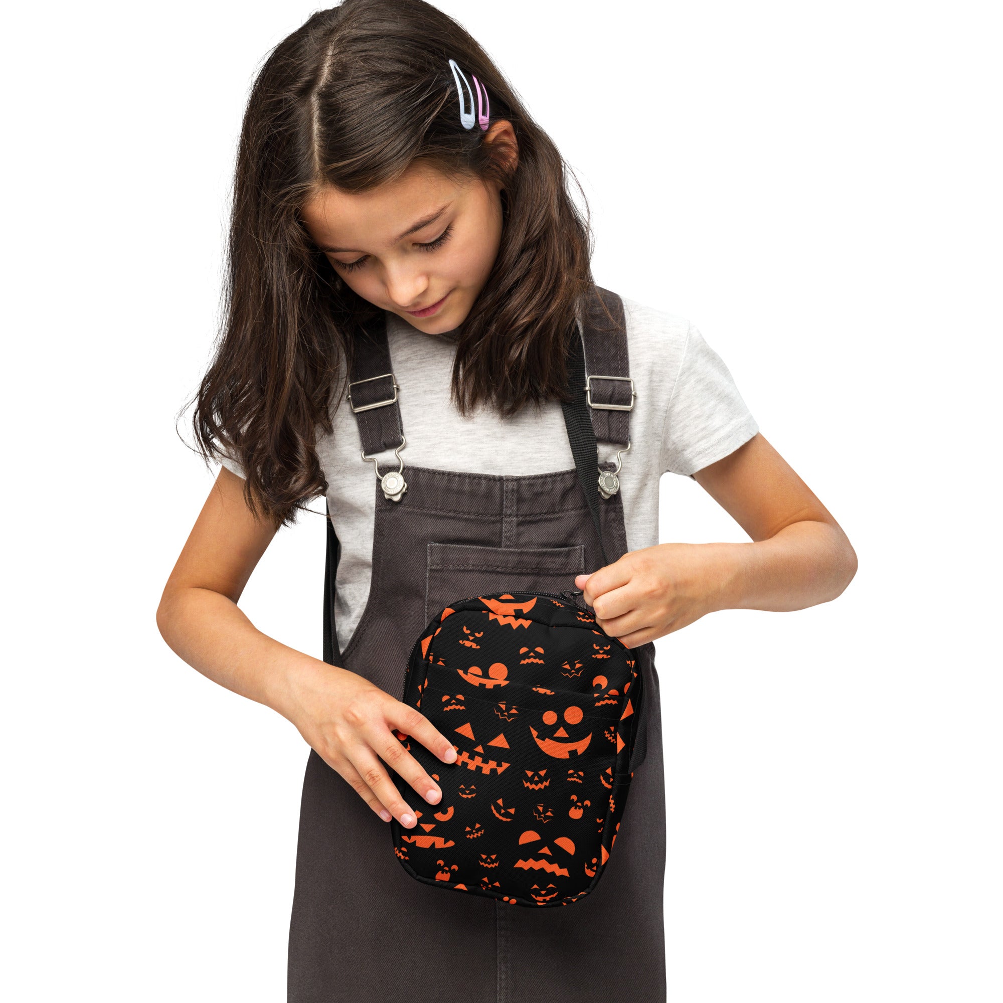Black fabric crossbody purse with orange jack-o-lantern faces for girls halloween accessory