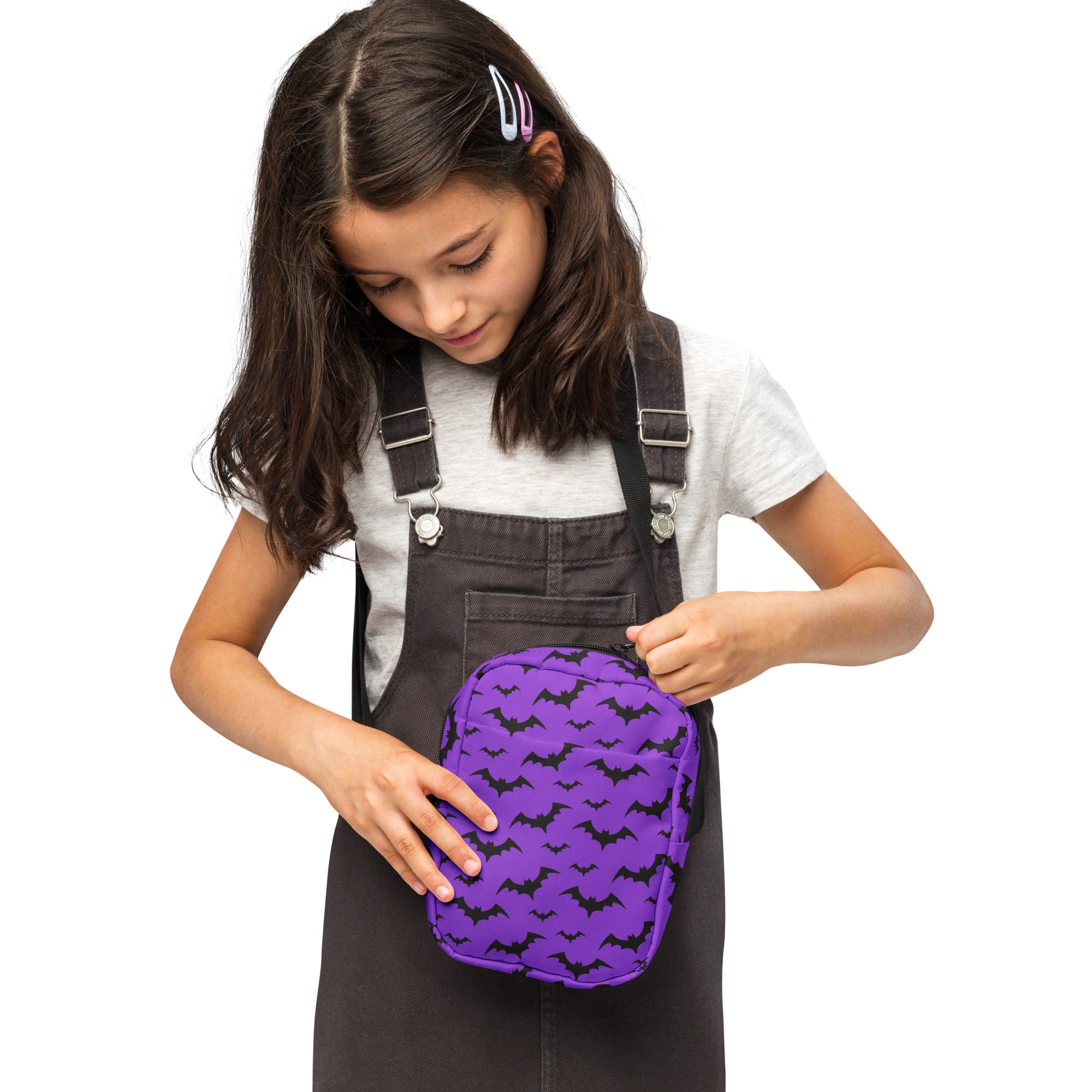 Kids purple bats halloween crossbody purse with black bat silhouettes on soft fabric surface