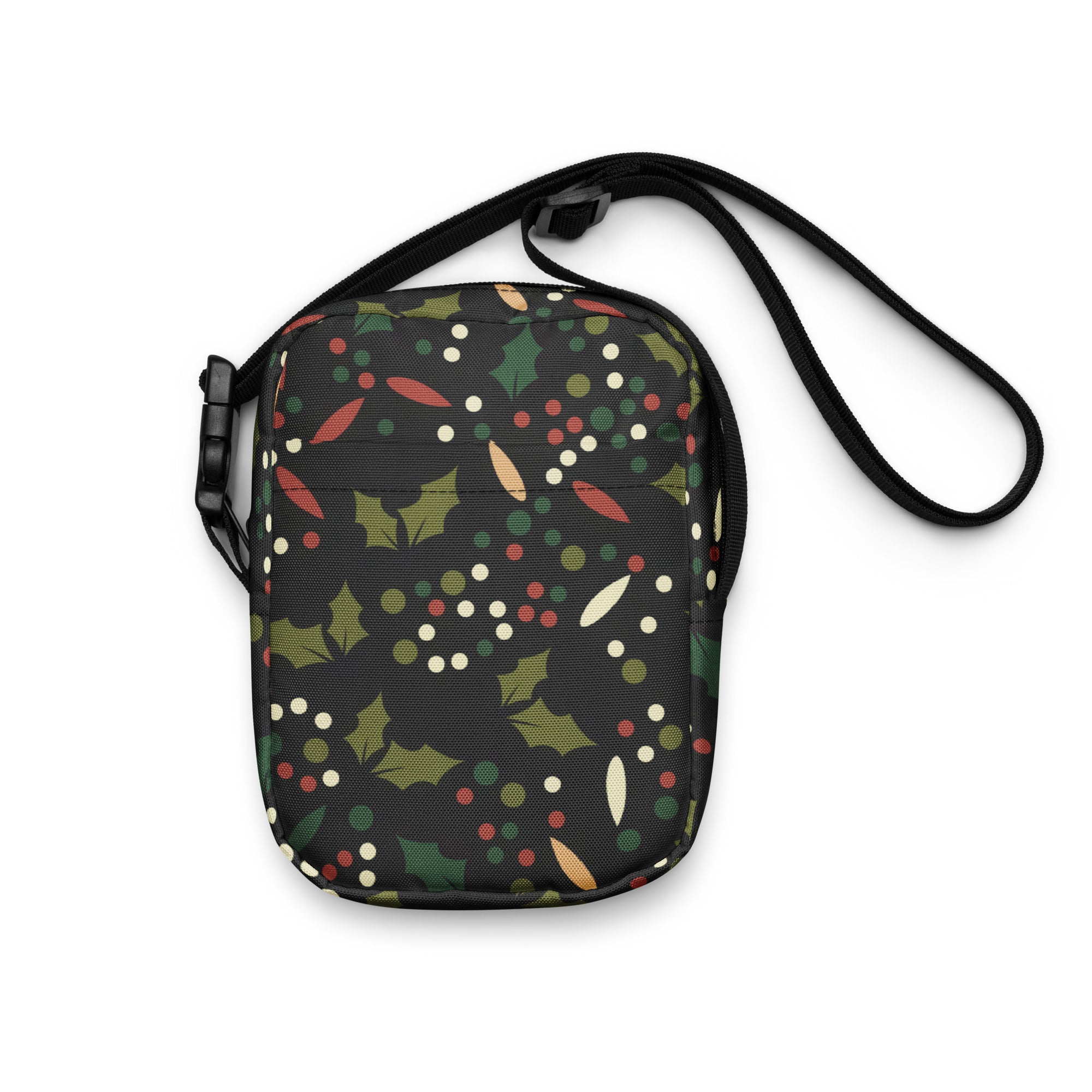 Girls christmas holly crossbody purse with black fabric featuring festive green holly leaves and red and white dots pattern
