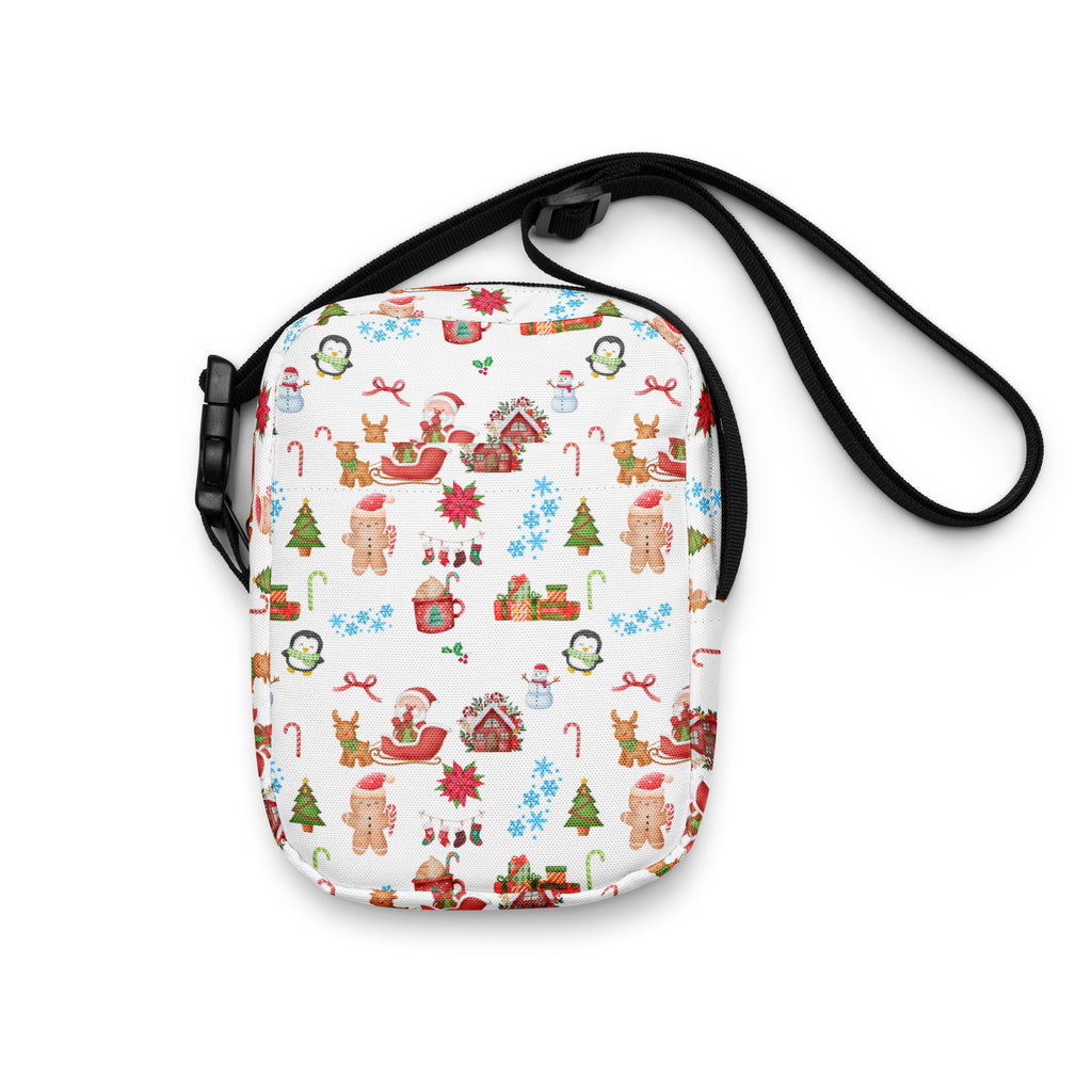 White crossbody bag with festive christmas pattern featuring gingerbread men penguins sleighs and candy canes