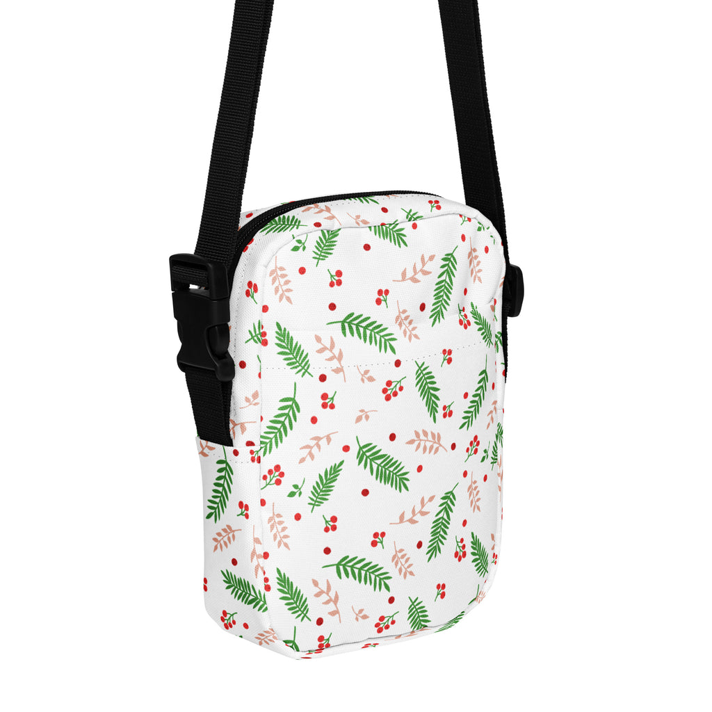 Girls winter greenery and red berries white crossbody bag with festive leaf pattern and black adjustable straps