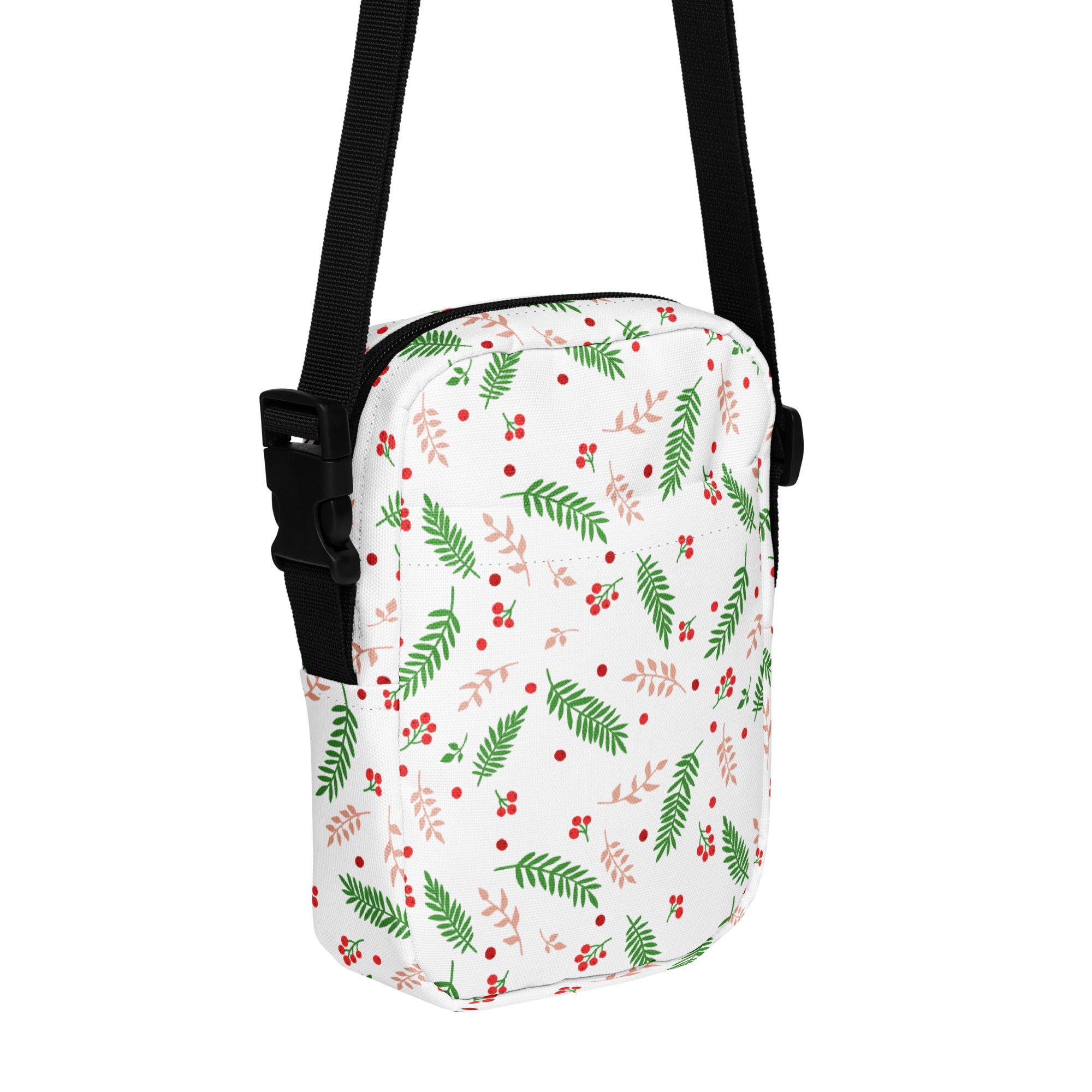 White winter fern and berry christmas women’s crossbody purse with green leaves red berries and black adjustable straps