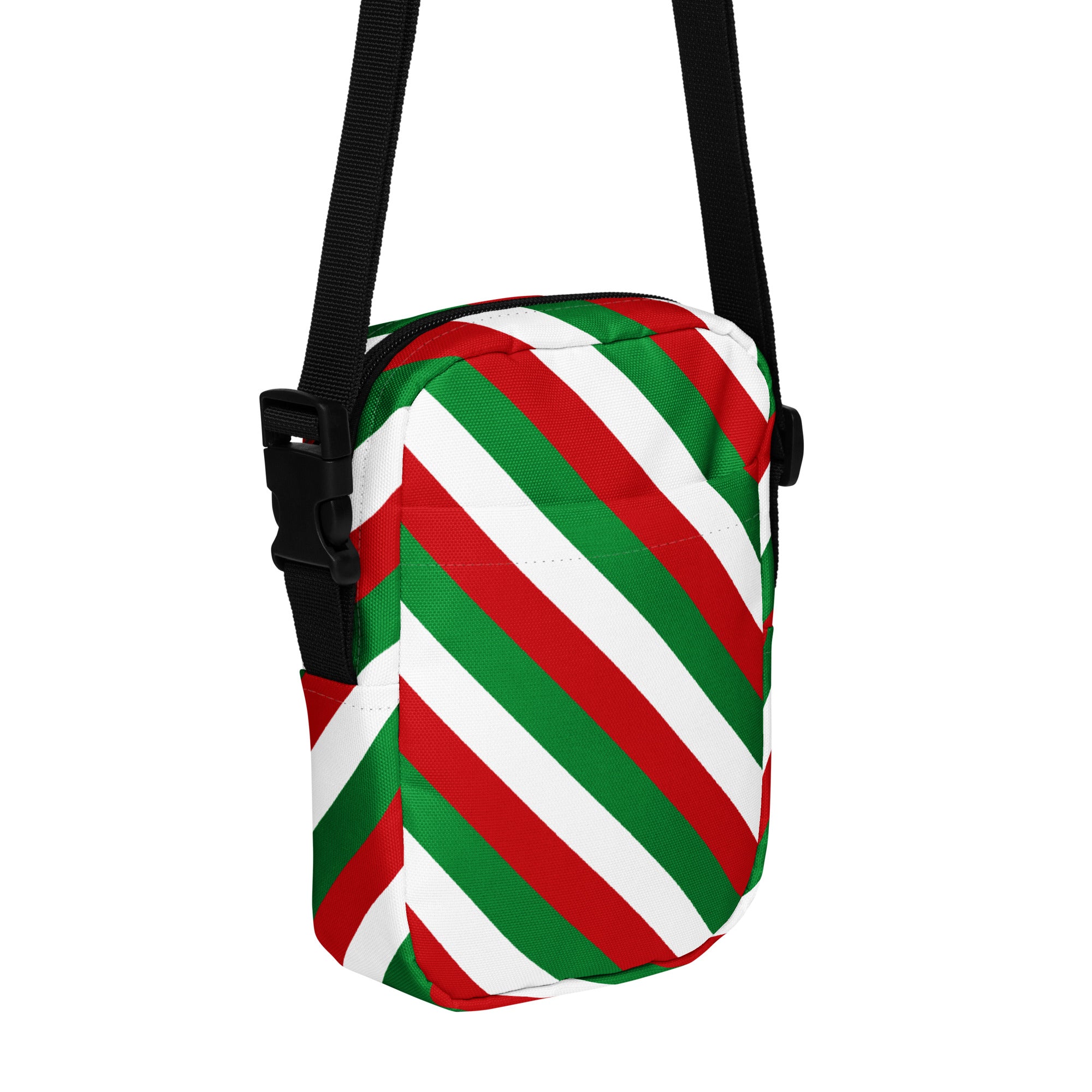 A festive red green and white diagonally striped crossbody purse with a black adjustable strap for women