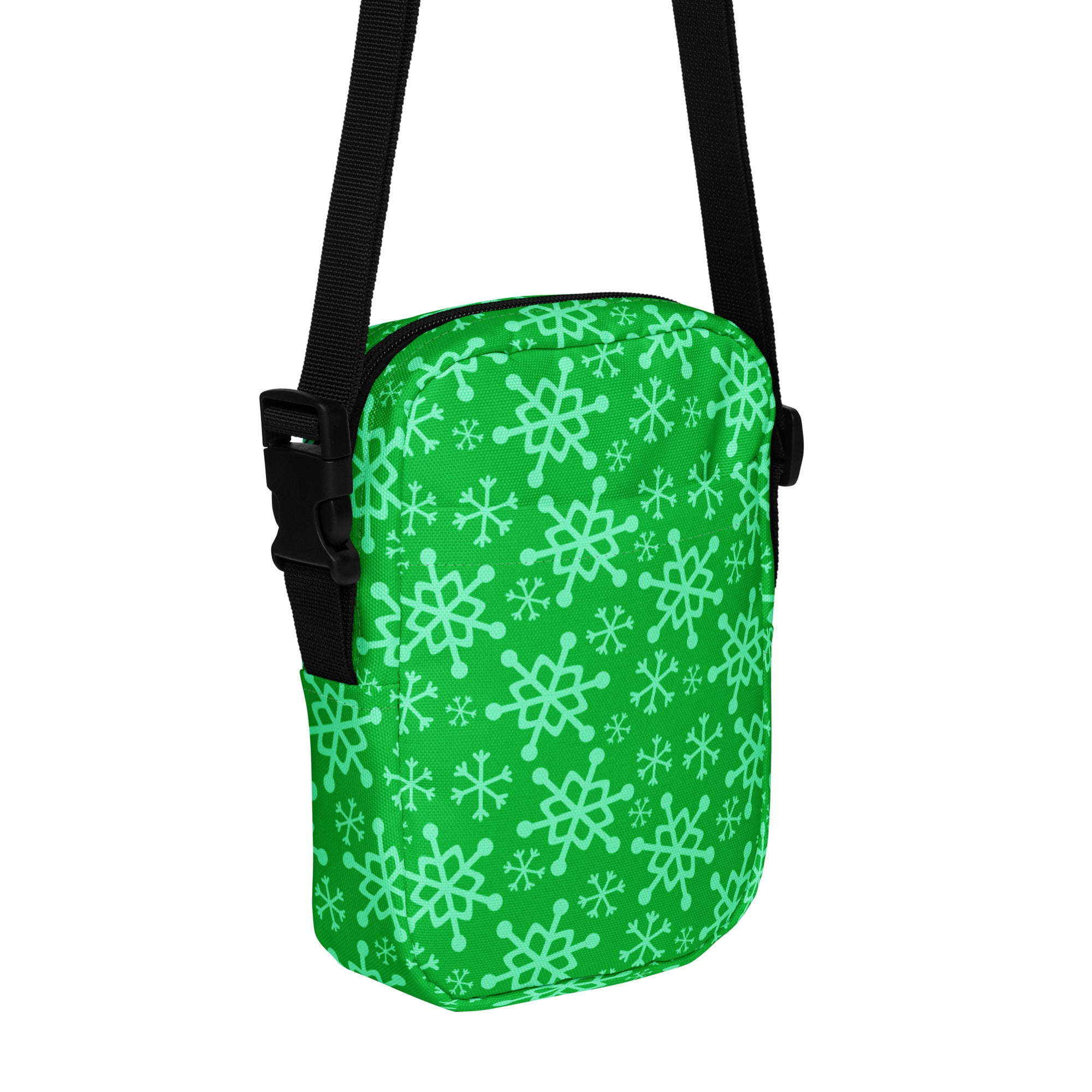 Girls green snowflakes crossbody purse with light green snowflake pattern and black adjustable strap