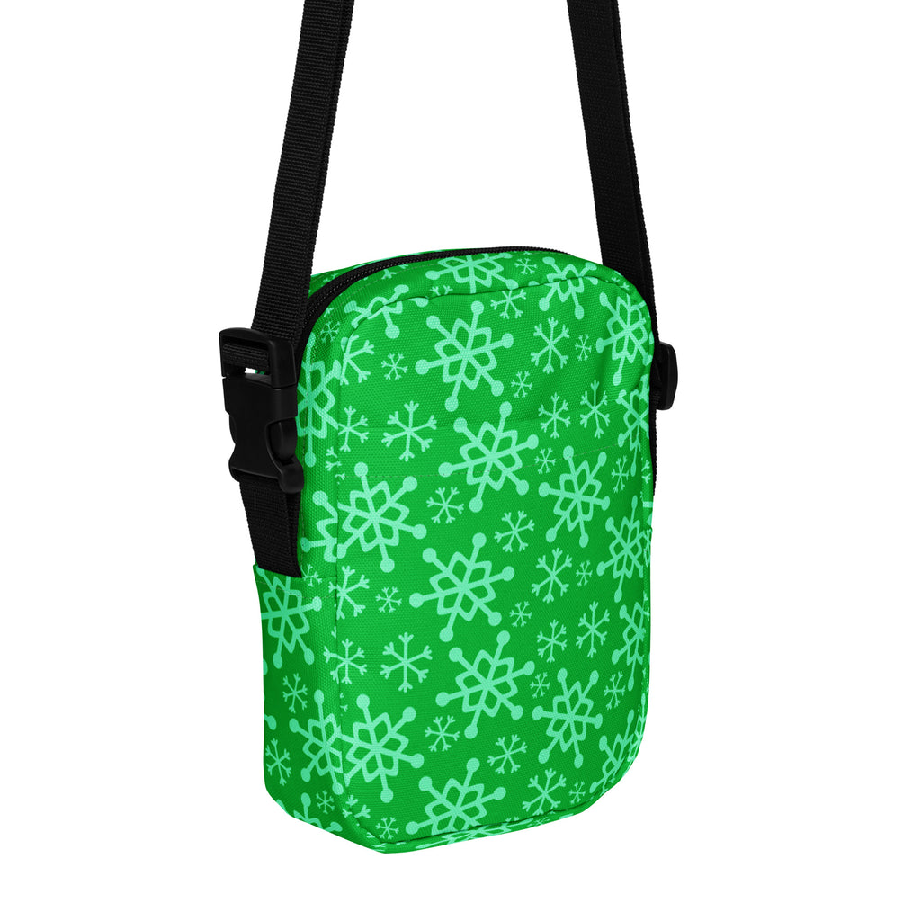 Green snowflake Christmas women’s crossbody purse with light green snowflake pattern and black adjustable strap