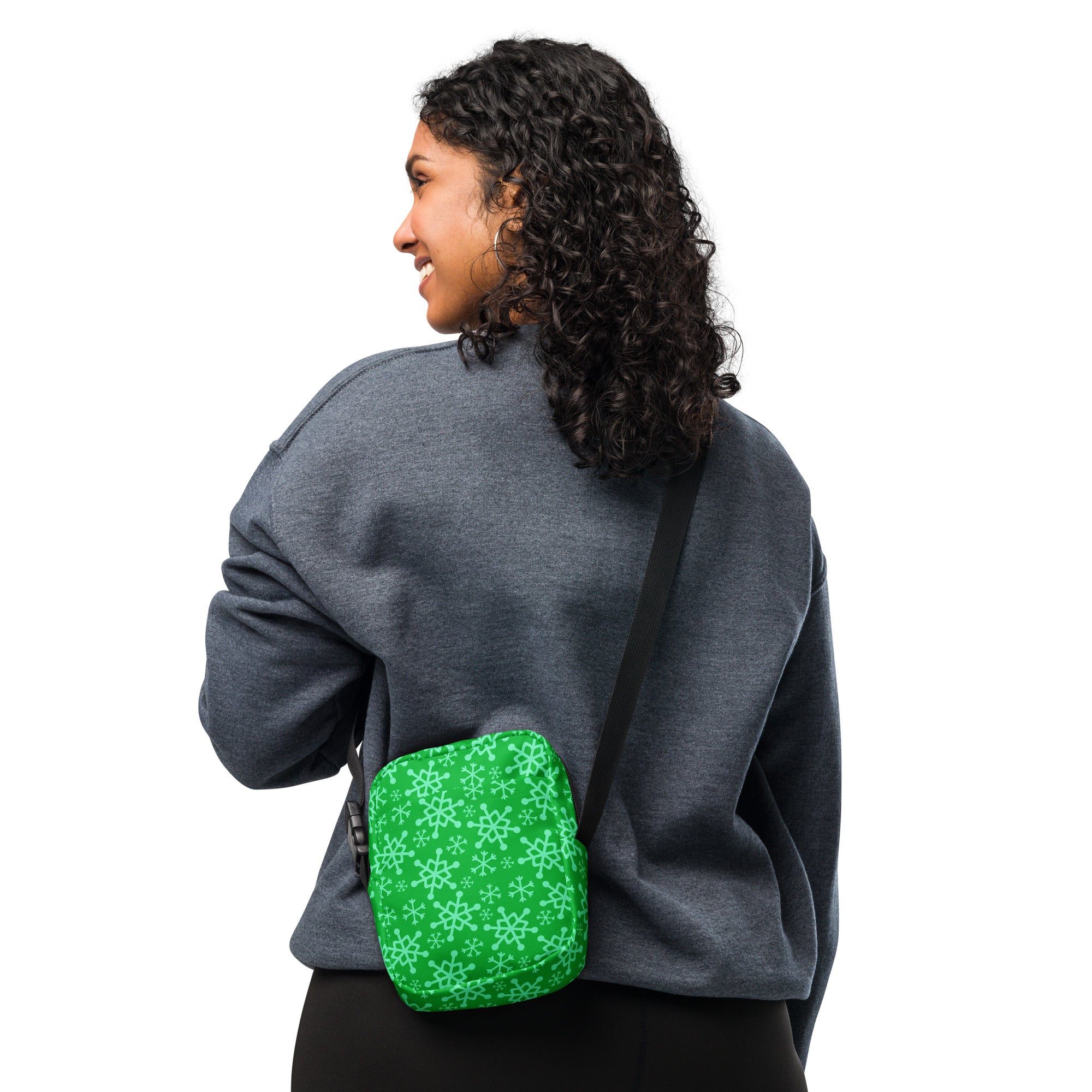 Green snowflake christmas women’s crossbody purse in green with light green snowflake pattern and adjustable strap
