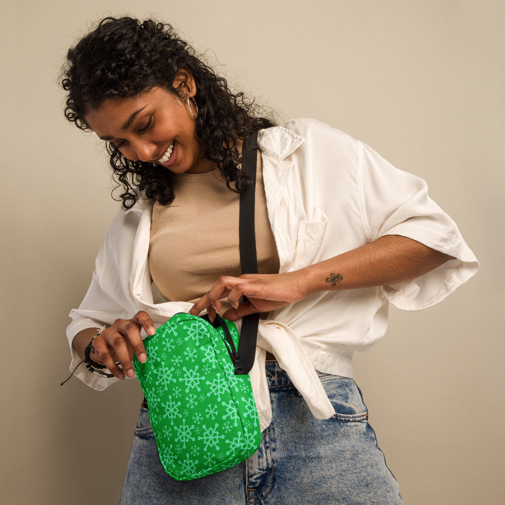 Green snowflake Christmas women’s crossbody purse in green with white snowflake pattern for festive use