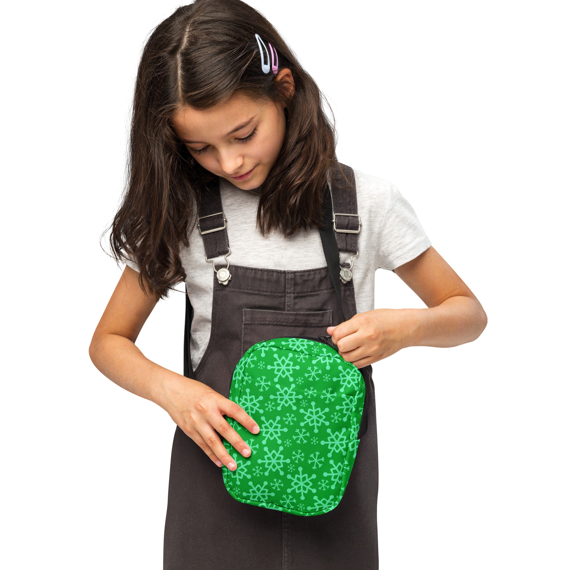 Girls green snowflakes crossbody purse with a soft fabric texture and rounded edges in a snowflake pattern pouch