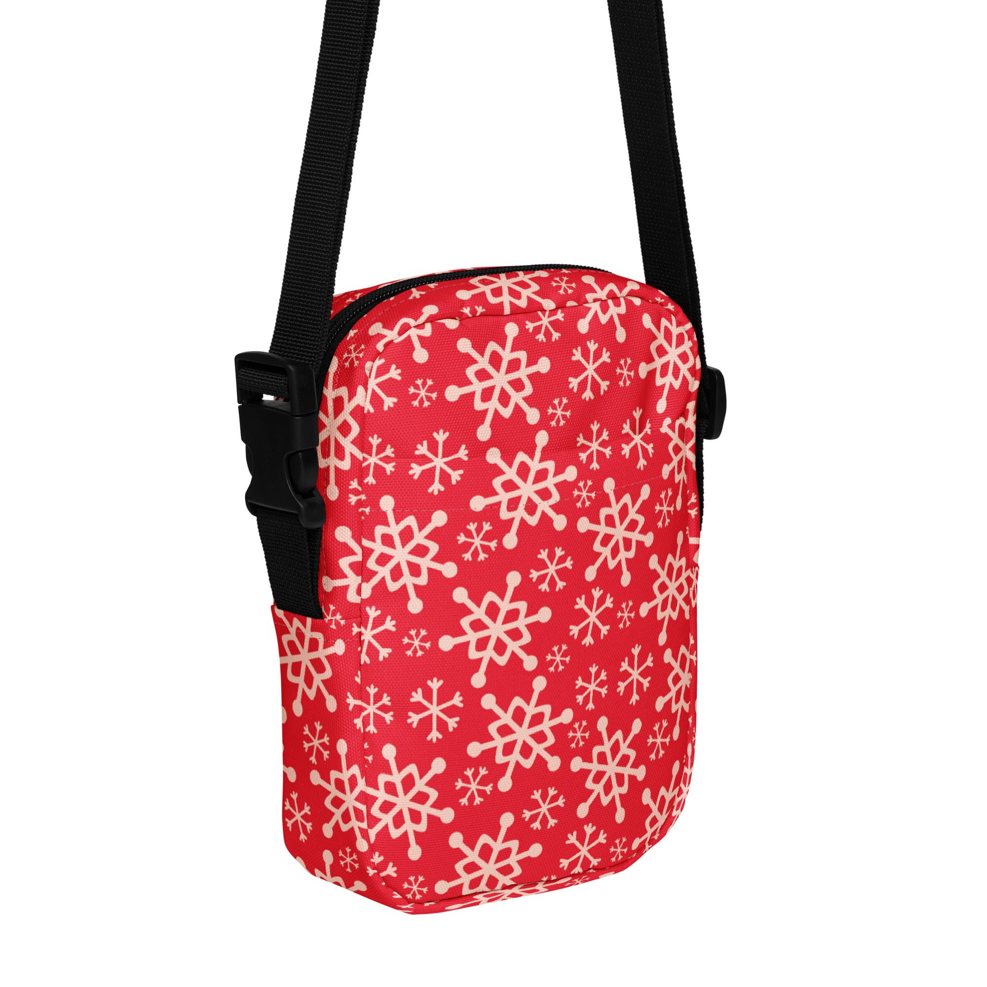Girls red crossbody purse with white snowflake pattern and black adjustable strap for winter style