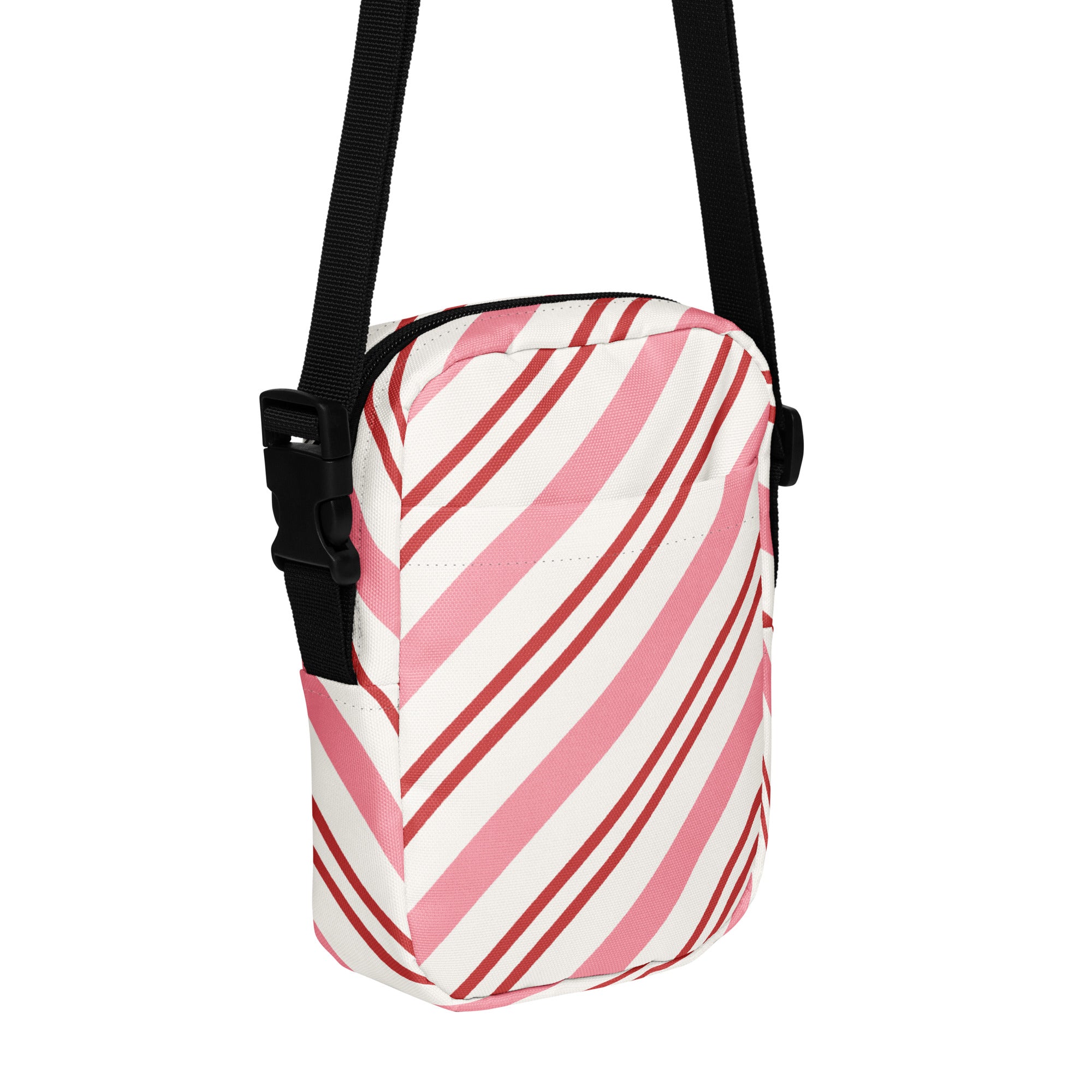Pink candy cane stripe christmas women’s crossbody purse in pink and white stripes with black adjustable strap