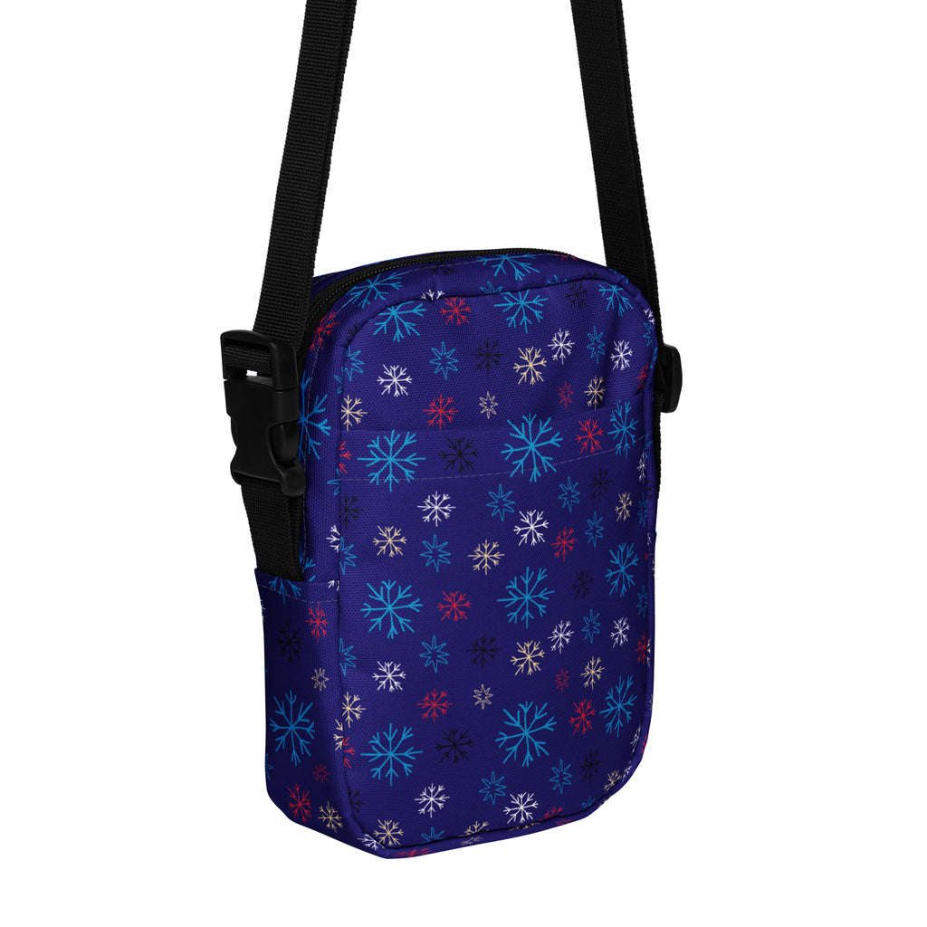 Girls navy crossbody purse with vibrant multicolor snowflake pattern in light blue white and red for everyday use