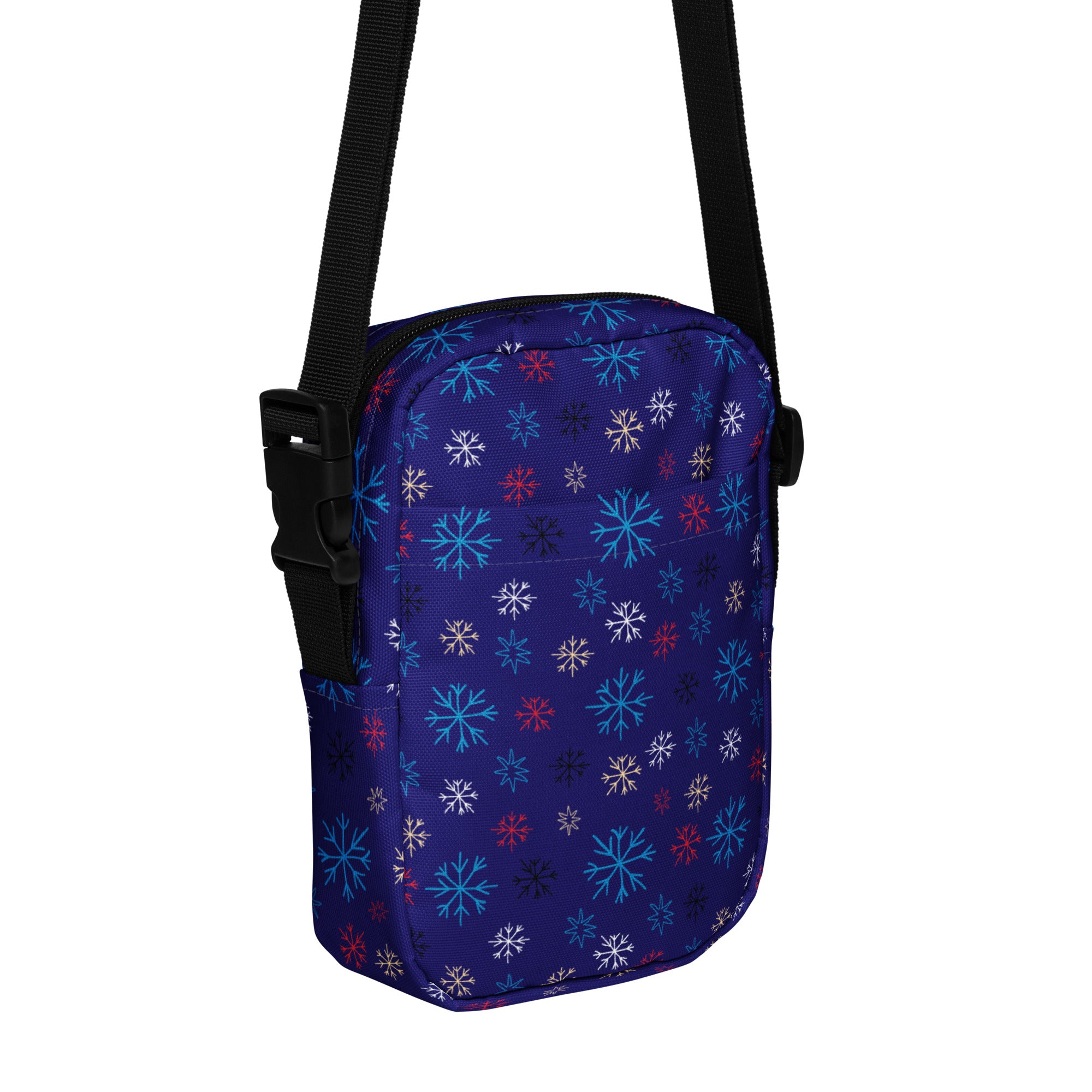 Girls navy crossbody purse with vibrant multicolor snowflake pattern in light blue white and red for everyday use