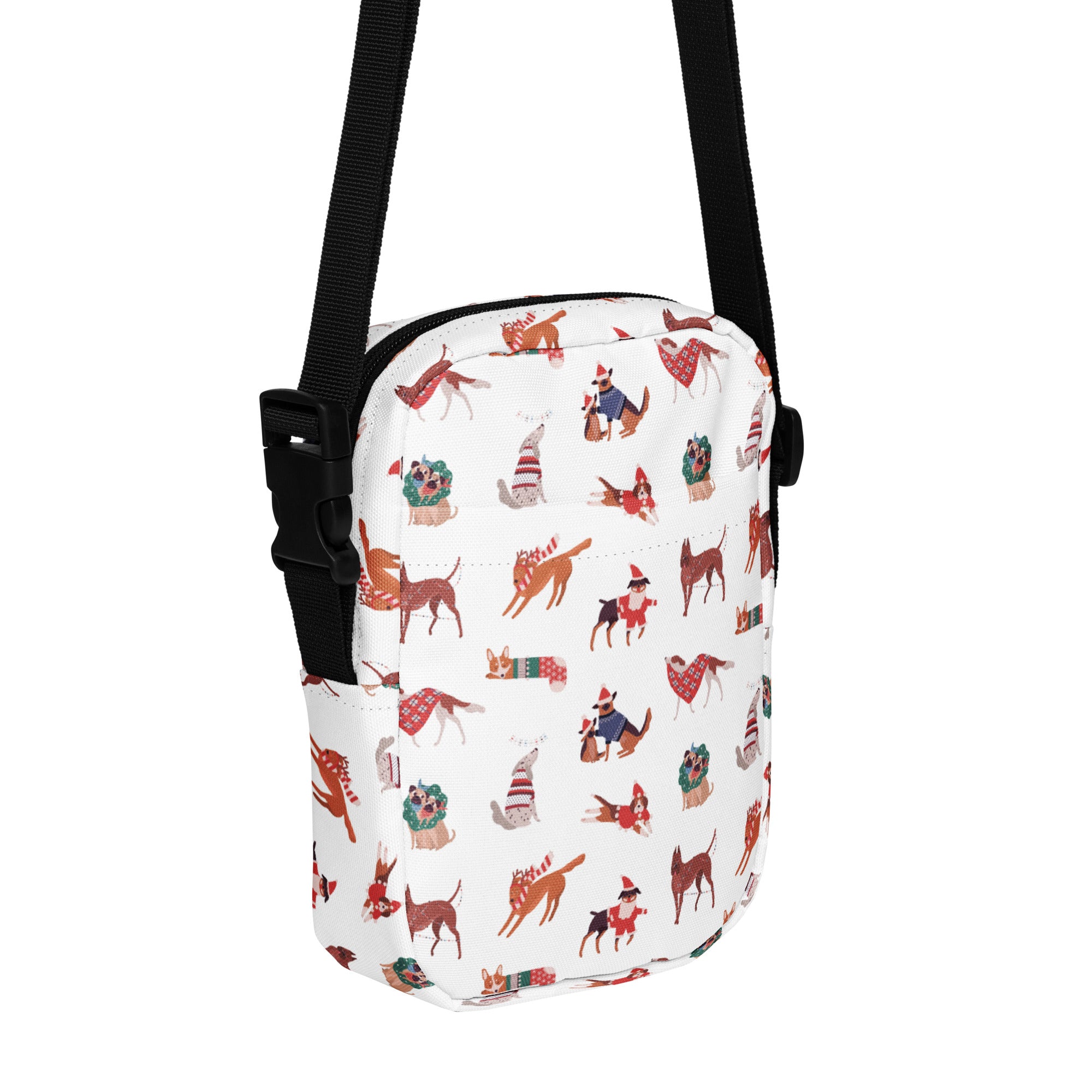 White crossbody bag with cartoon dogs in festive holiday attire and black adjustable strap for girls christmas use