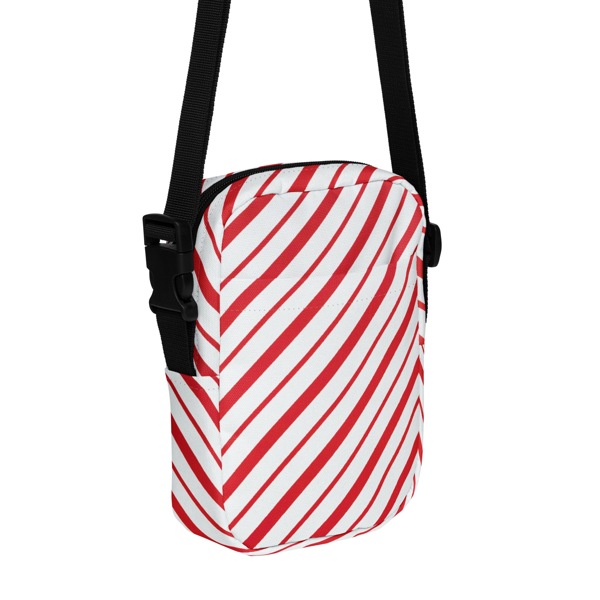 Red candy stripe christmas women’s crossbody purse with red and white diagonal stripes and black adjustable strap