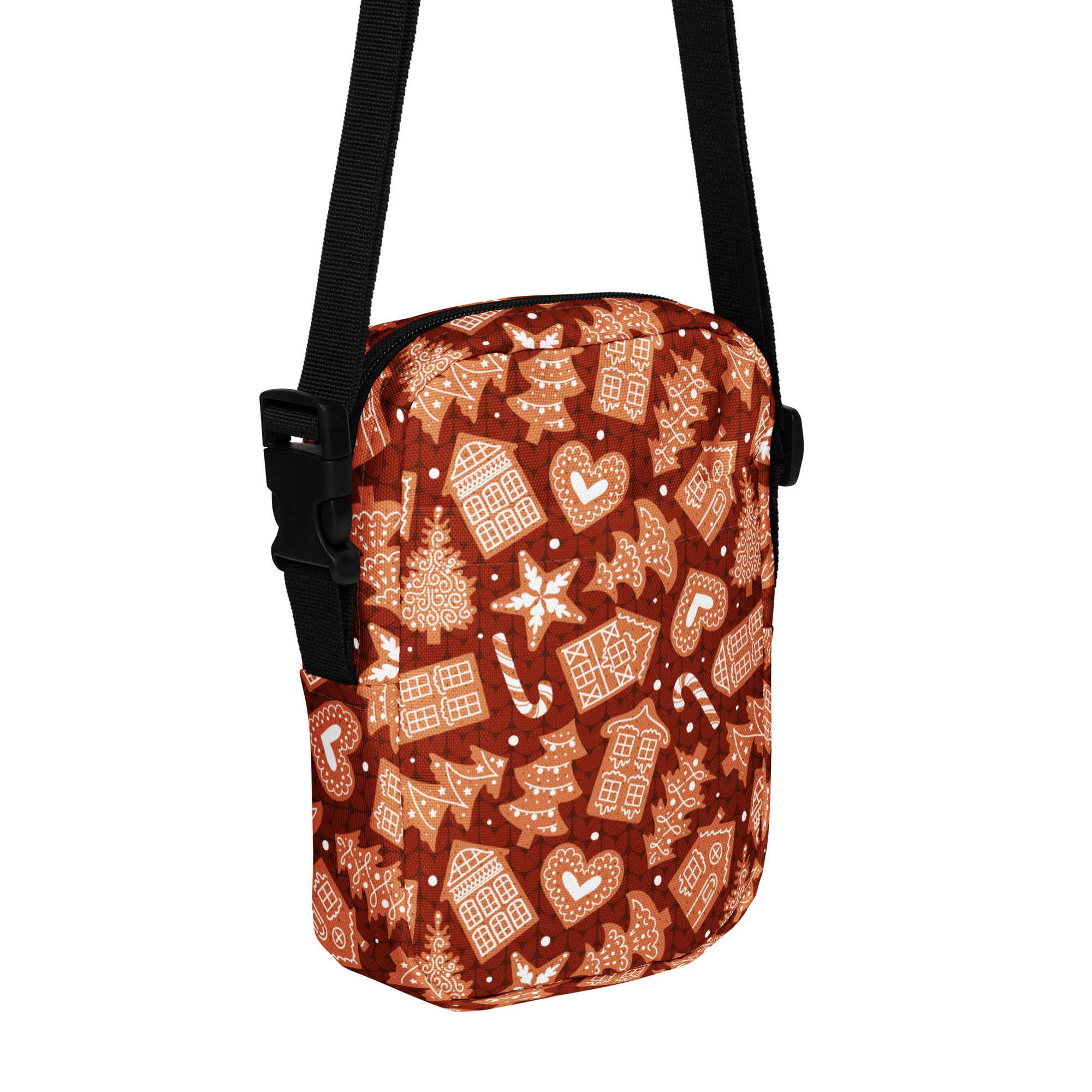 A festive brown crossbody bag with gingerbread house candy cane and star pattern for Christmas use