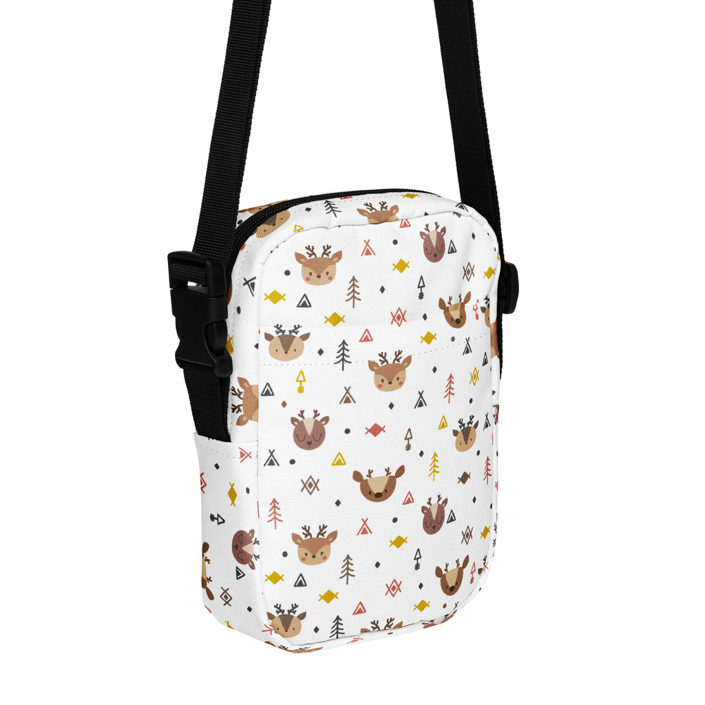 Girls cute reindeer Christmas crossbody purse in white with playful brown deer green trees and colorful geometric shapes
