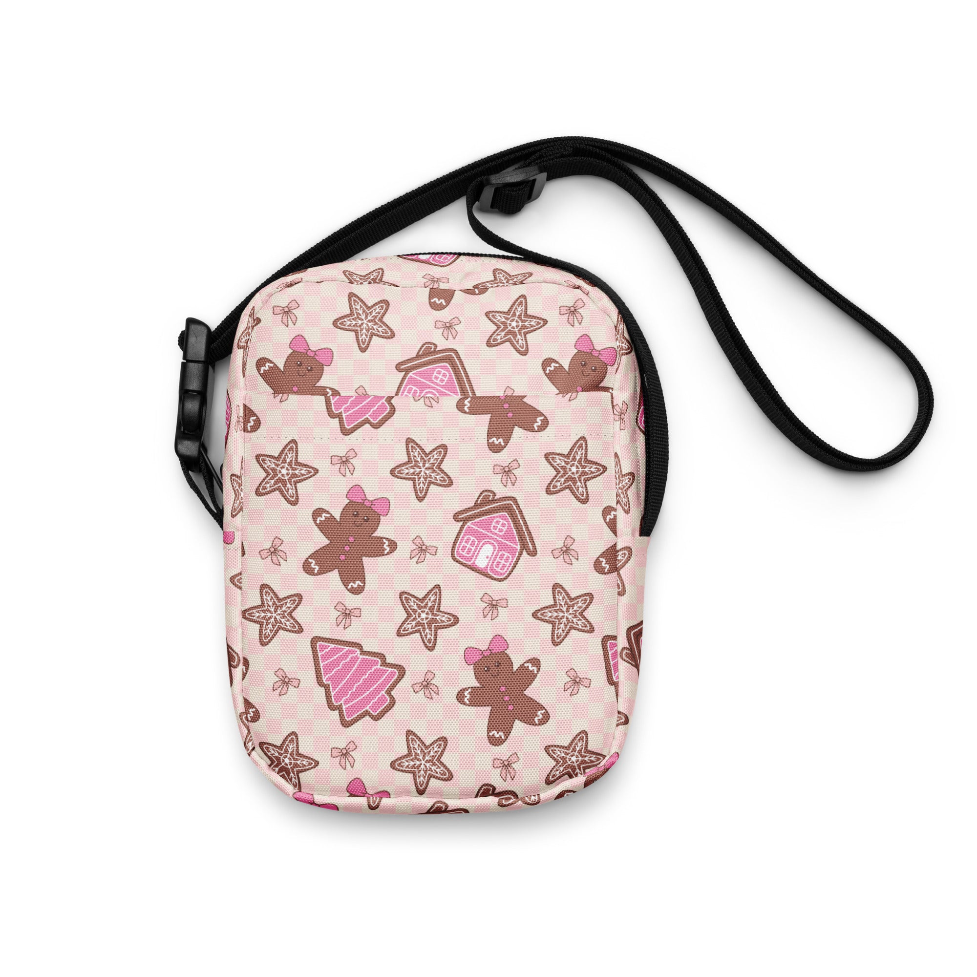 Girls pink crossbody purse with playful gingerbread men star cookies and tiny house pattern for Christmas use