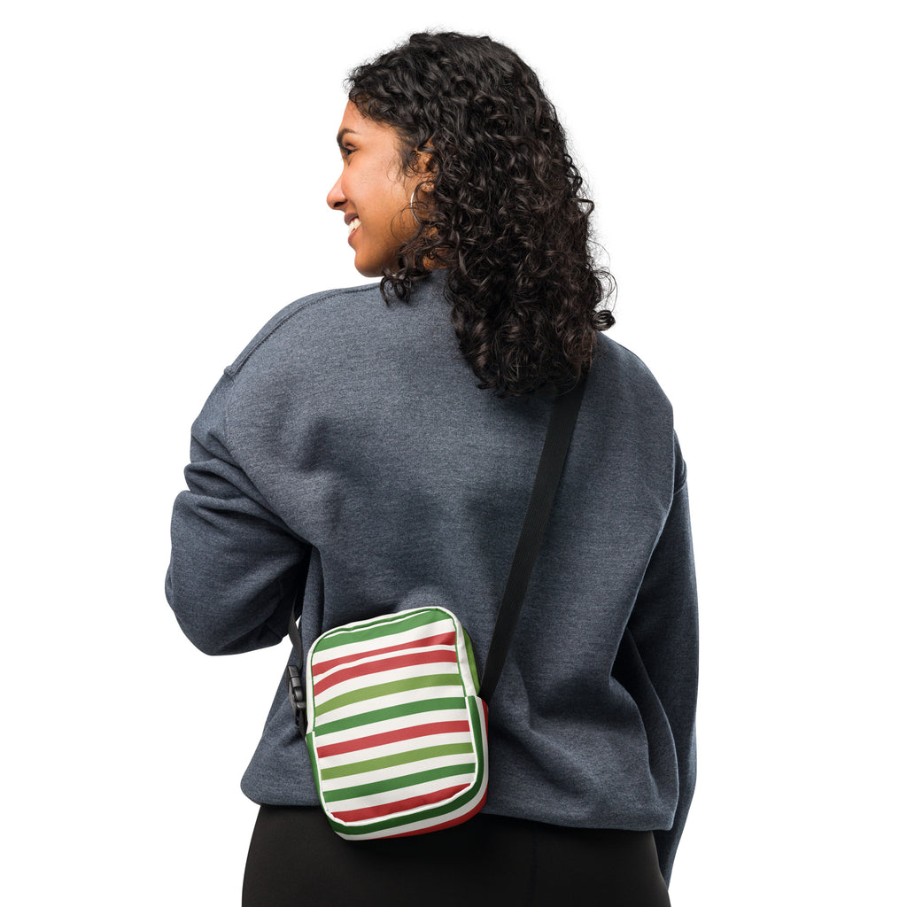 A compact christmas striped women’s crossbody purse with bold red green and white horizontal stripes on soft fabric