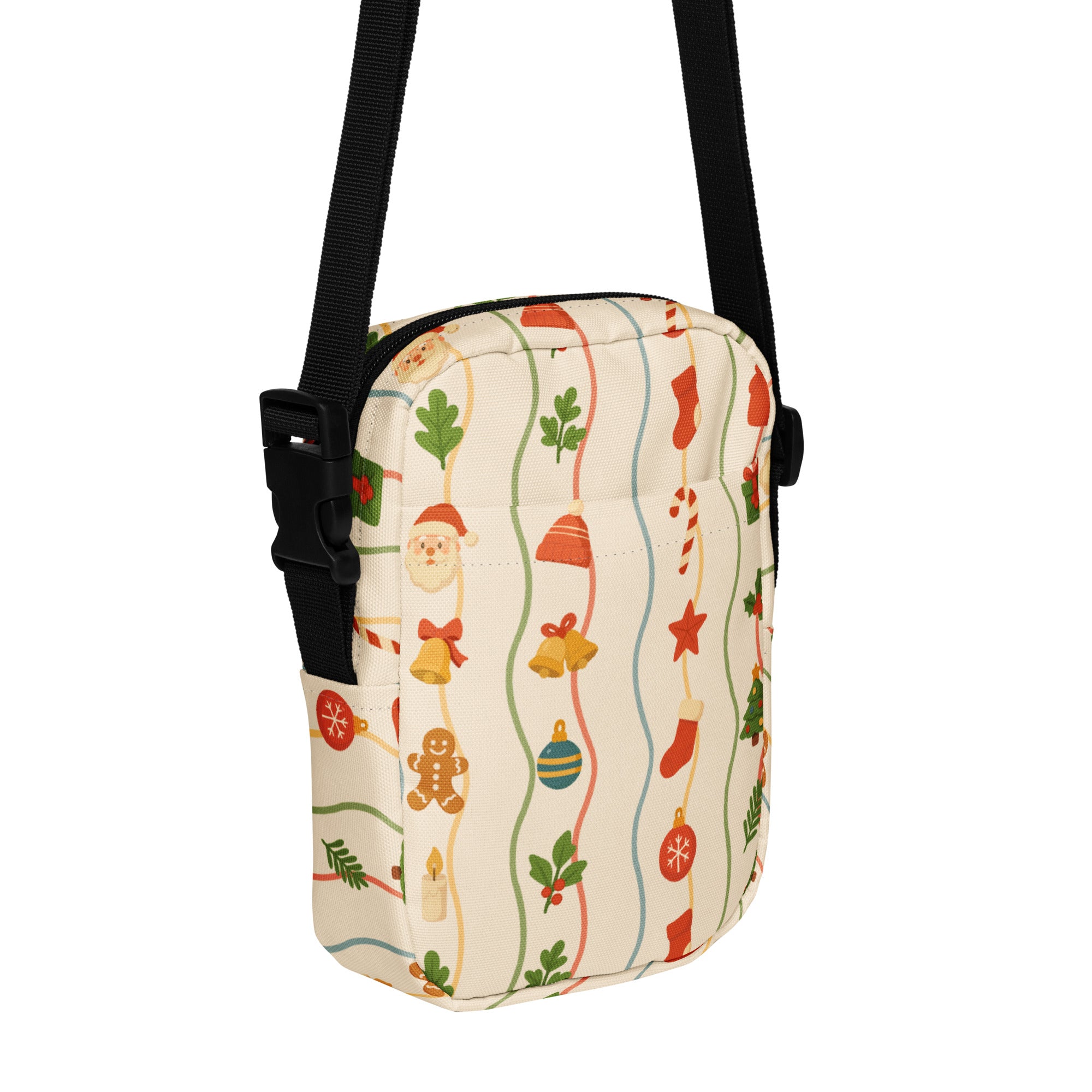 A festive cream-colored Christmas Garland women’s crossbody purse with red green and gold ornament patterns on stripes