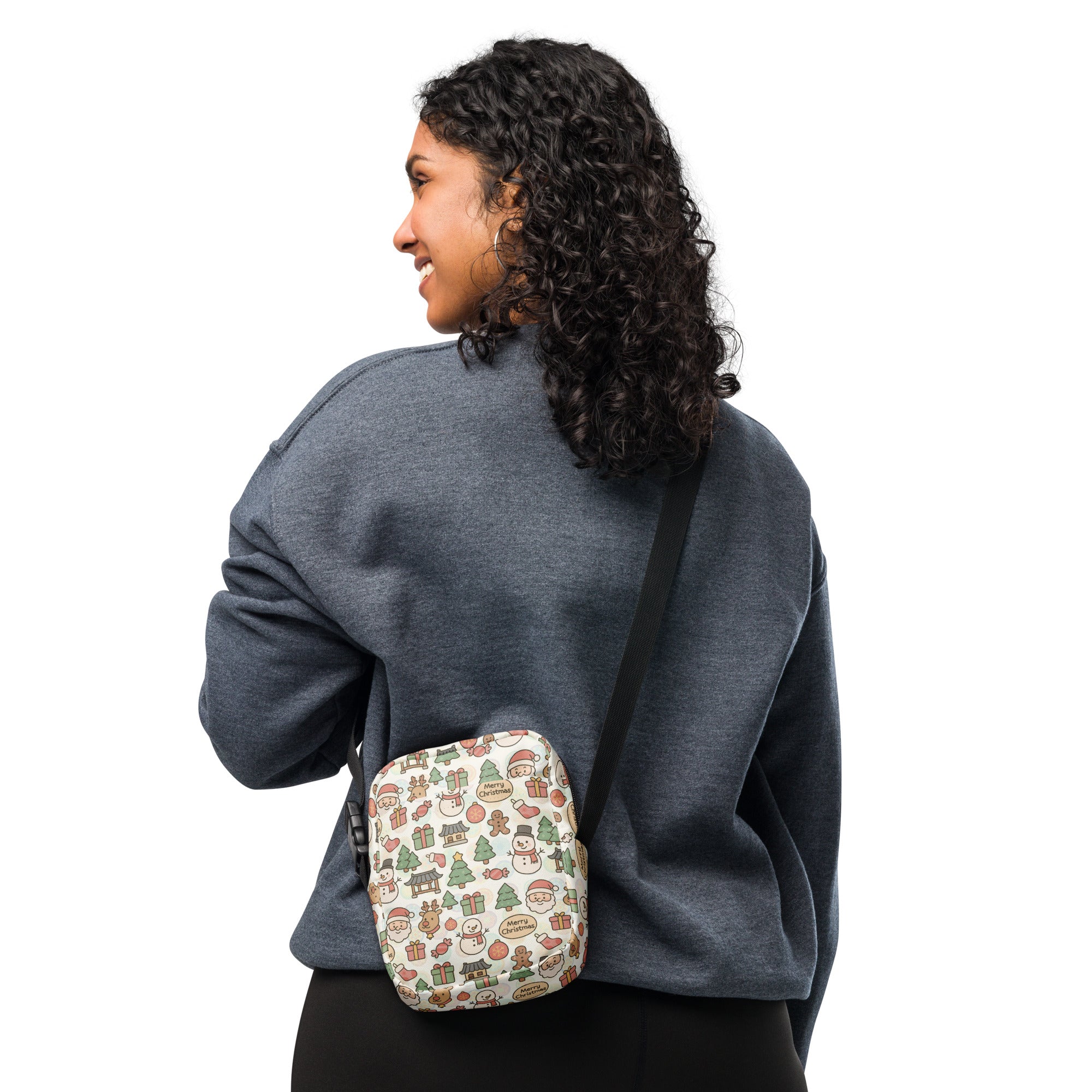 A festive cream-colored Christmas doodle women’s crossbody purse with playful snowmen trees and gifts pattern