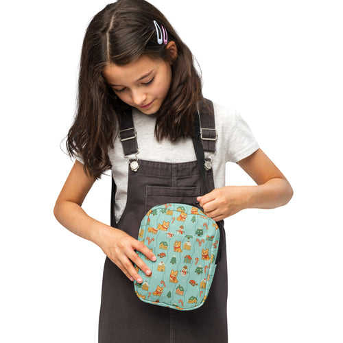 Teal quilted girls corgi winter wonderland crossbody purse with cartoon foxes houses and candy canes pattern